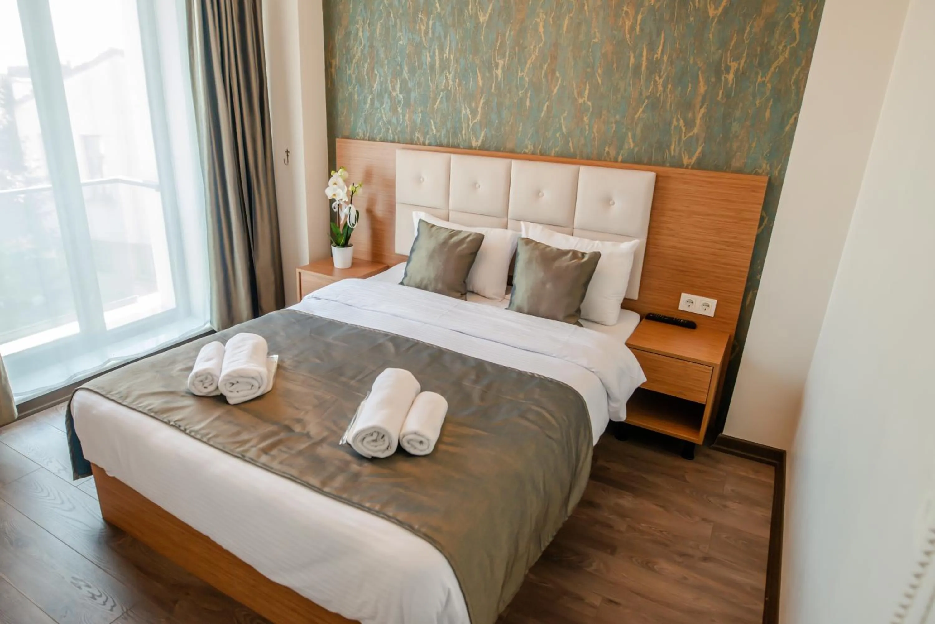 Bed in The Camelot Hotel