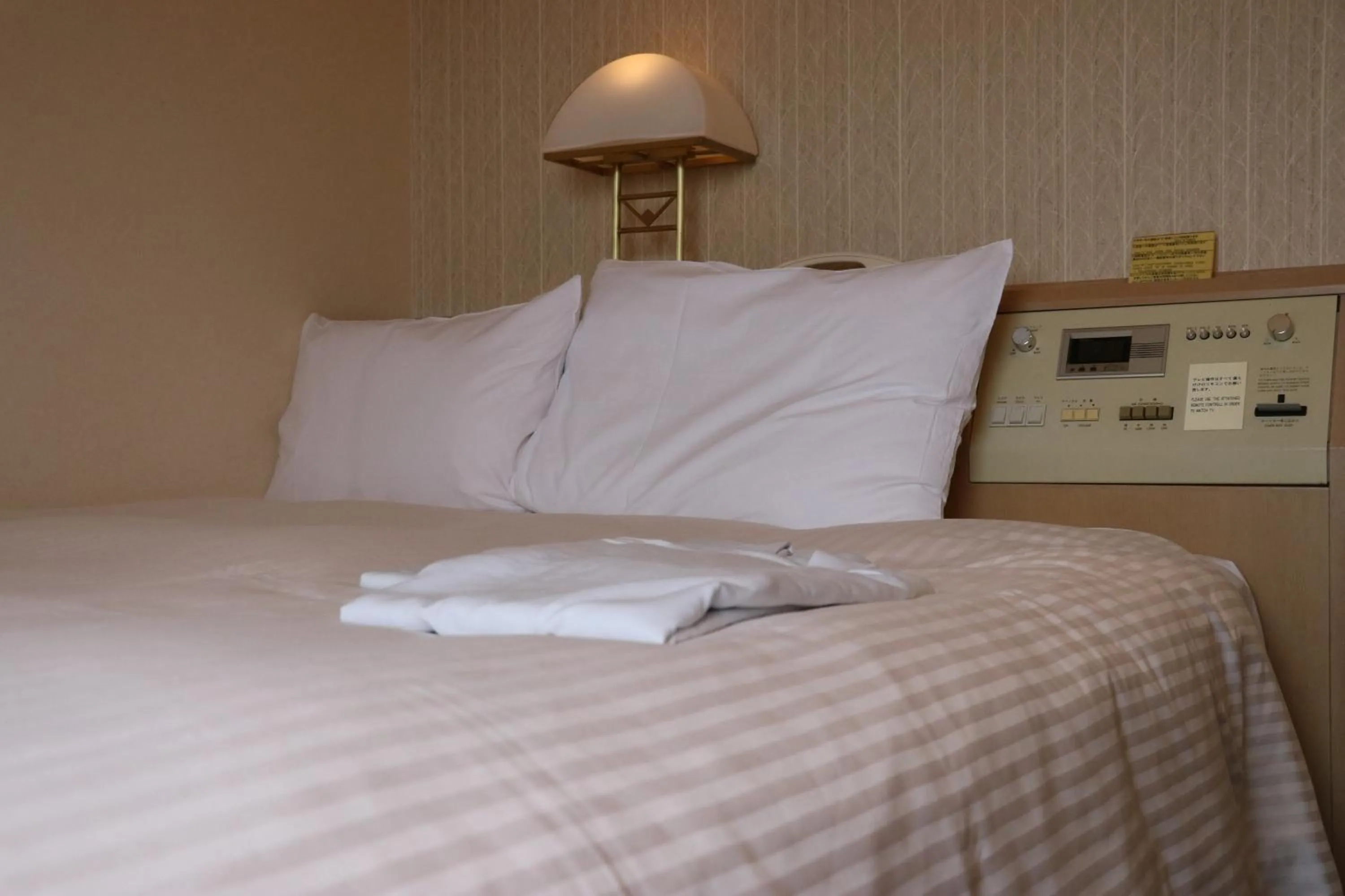 Bed in Aizuwakamatsu Washington Hotel