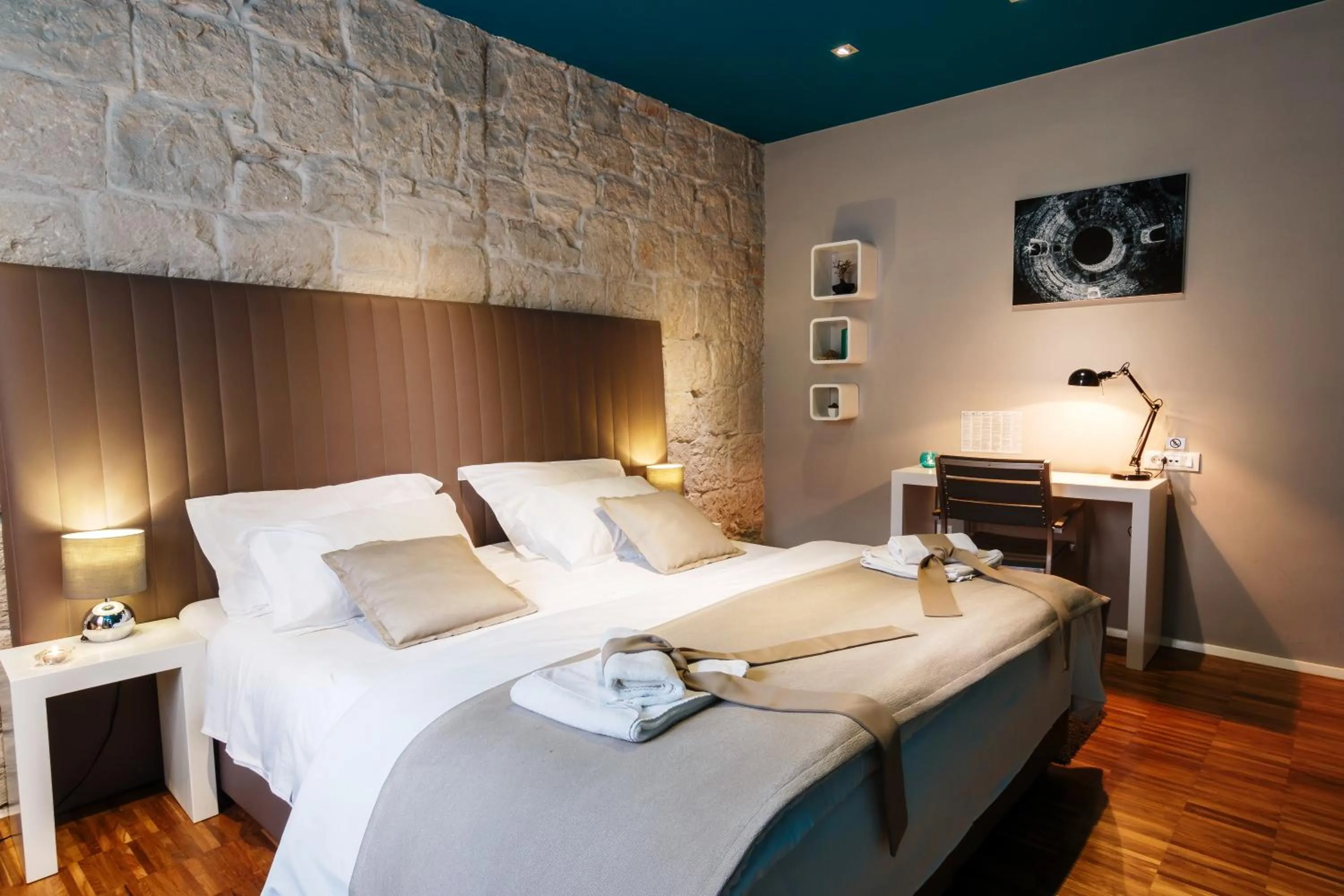 Bed in Riva Luxury Rooms