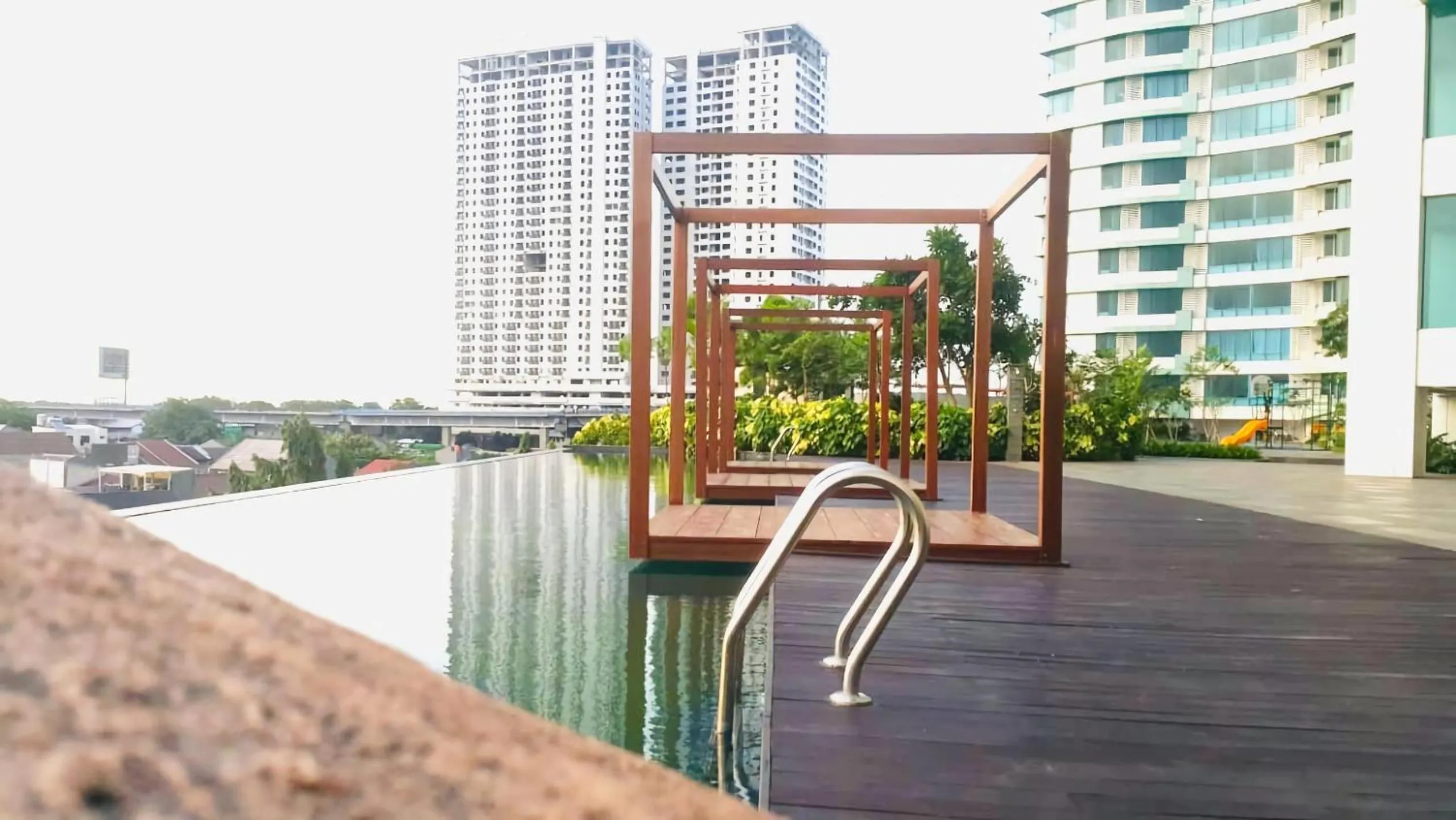 Swimming pool in Apartemen Grand Kamala Lagoon Studio By Bonzela Property