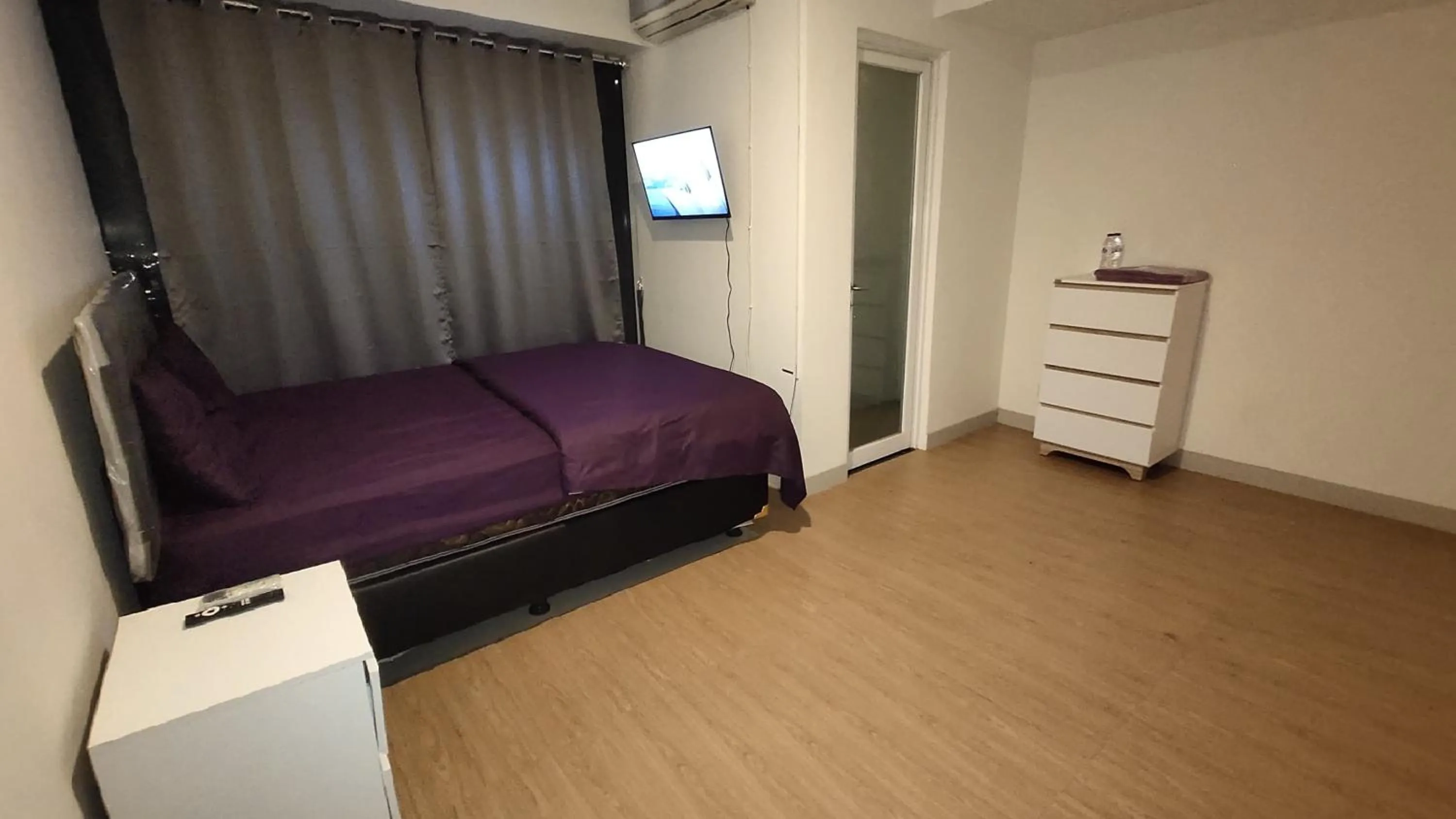 Bed in Apartemen Grand Kamala Lagoon Studio By Bonzela Property