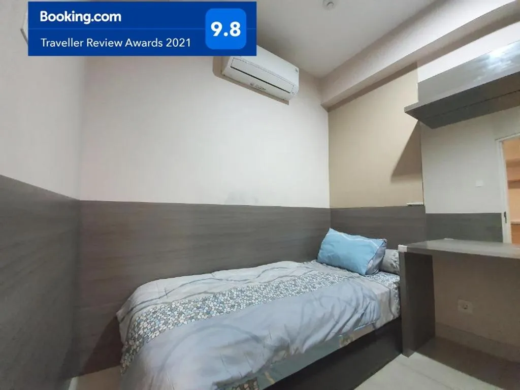 Bed in Apartemen Grand Kamala Lagoon Studio By Bonzela Property