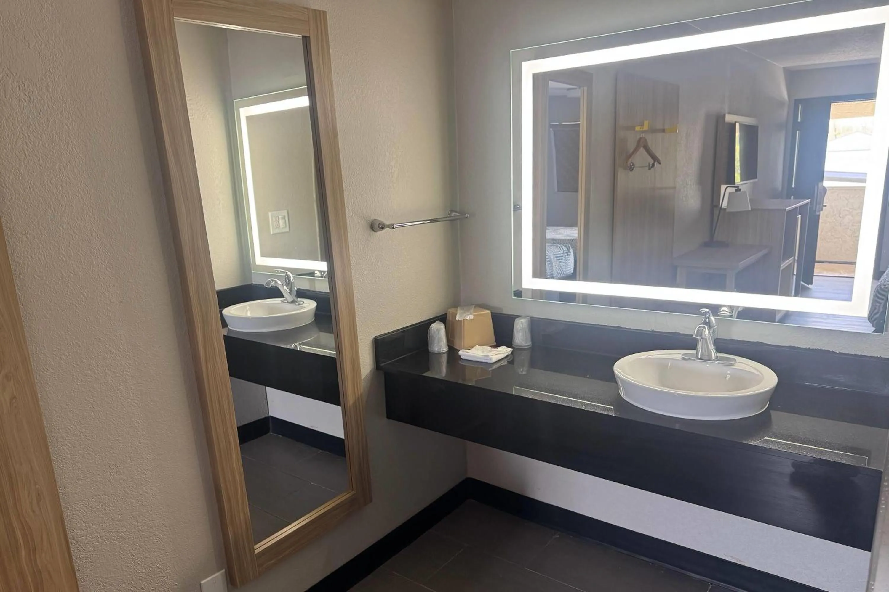 Bathroom in Days Inn by Wyndham Kansas City Northeast