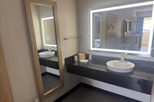 Bathroom in Days Inn by Wyndham Kansas City Northeast