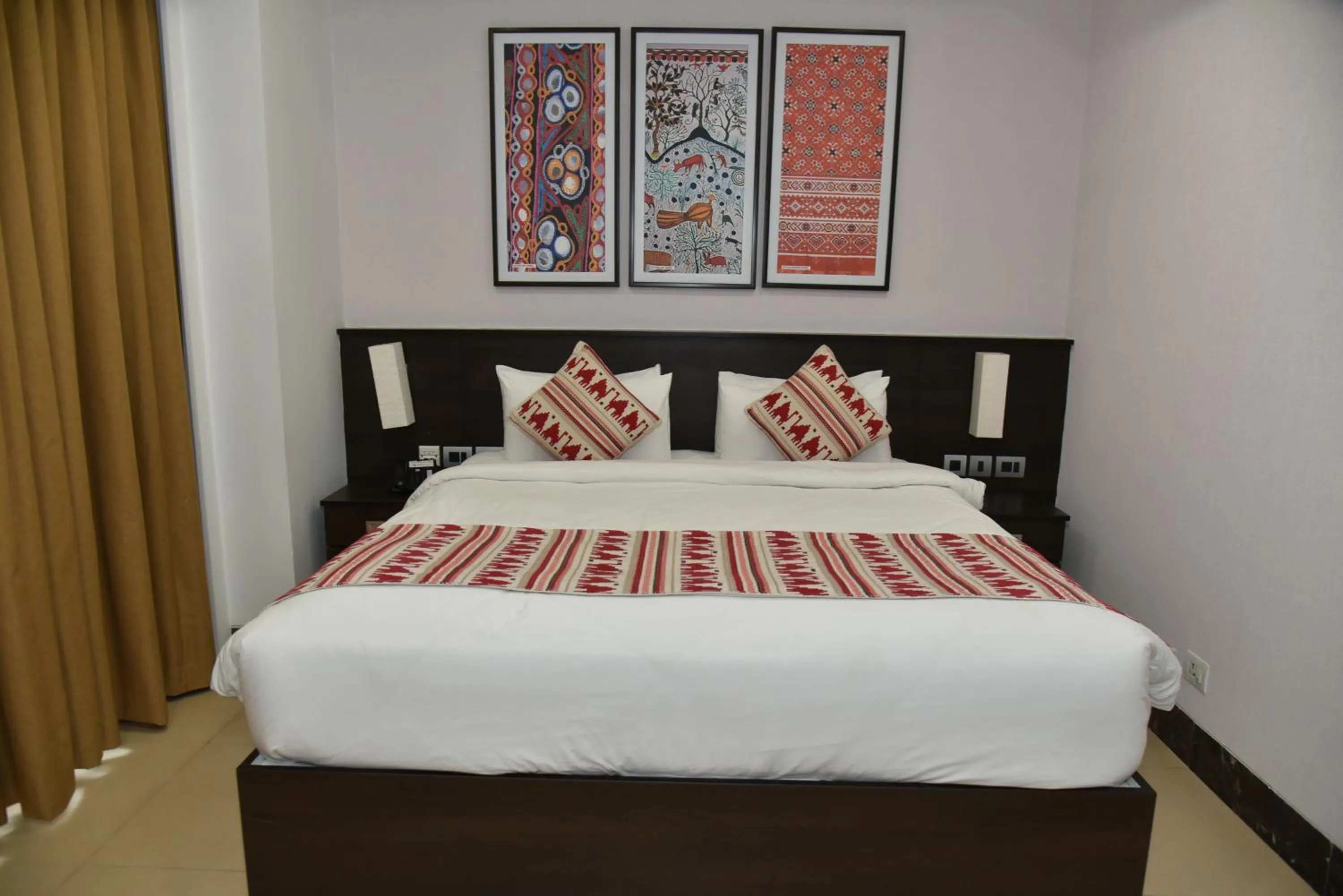Bed in Ramada Encore by Wyndham Statue of Unity
