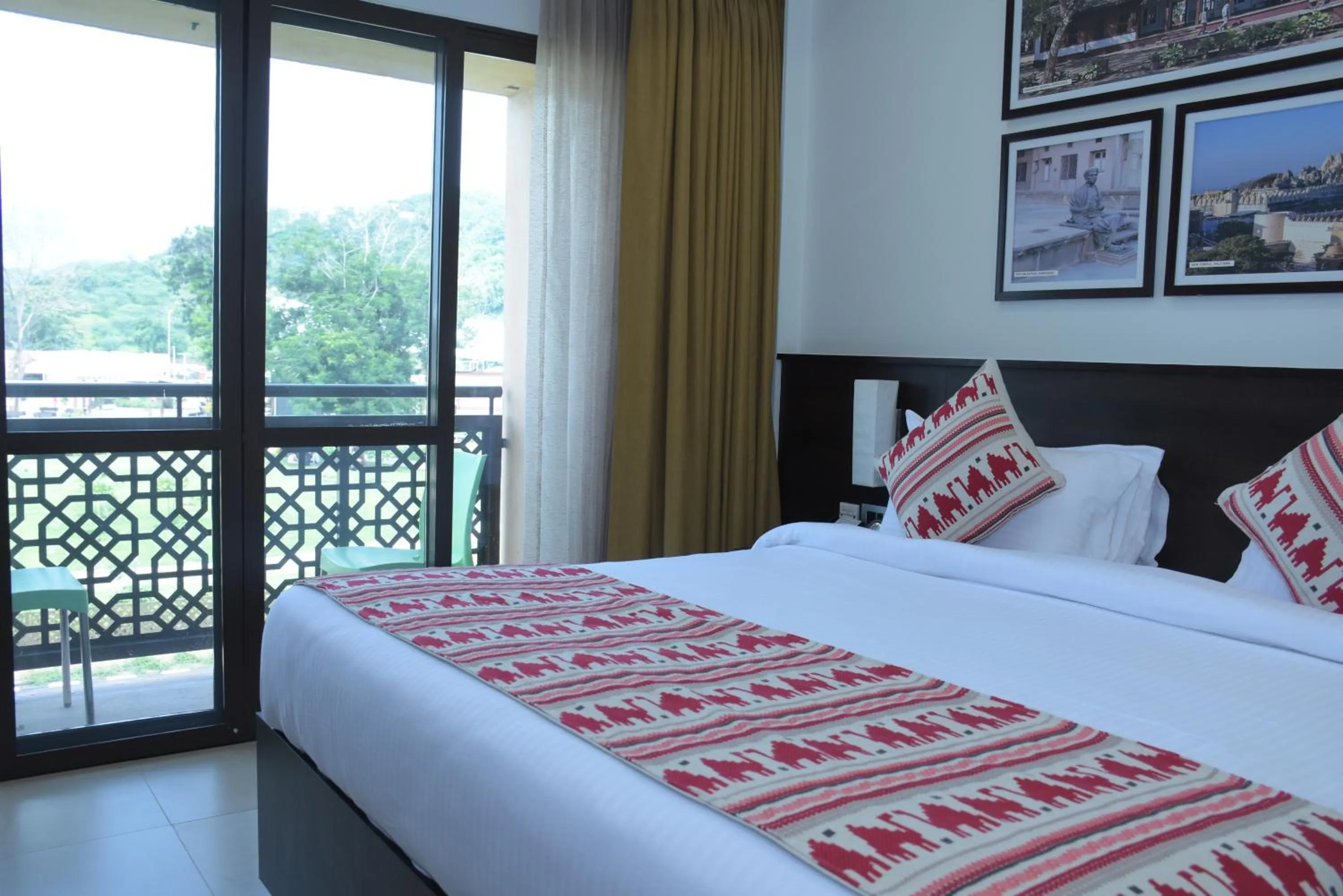 Bed in Ramada Encore by Wyndham Statue of Unity