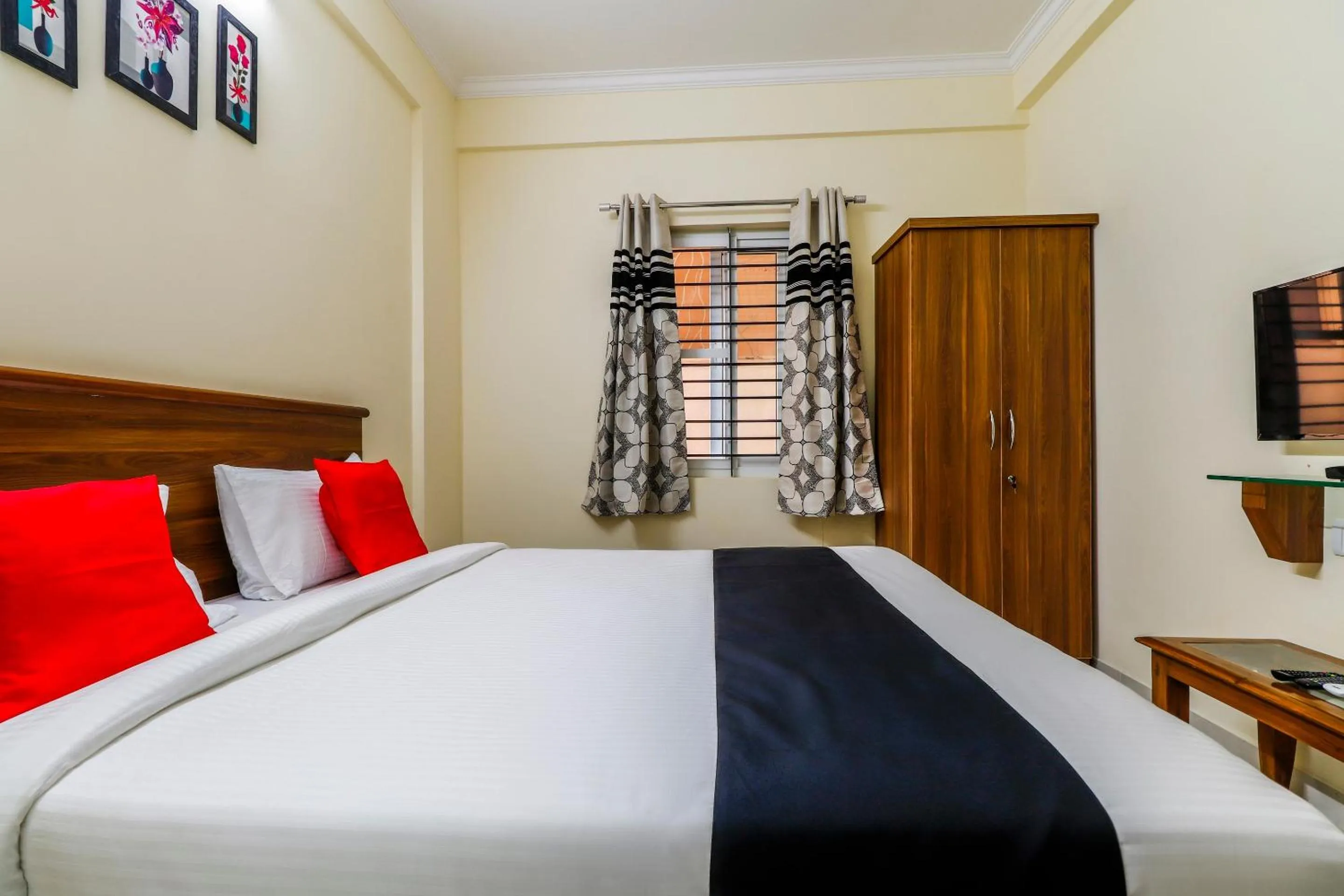 Bedroom, Bed in Capital O SLN Residency
