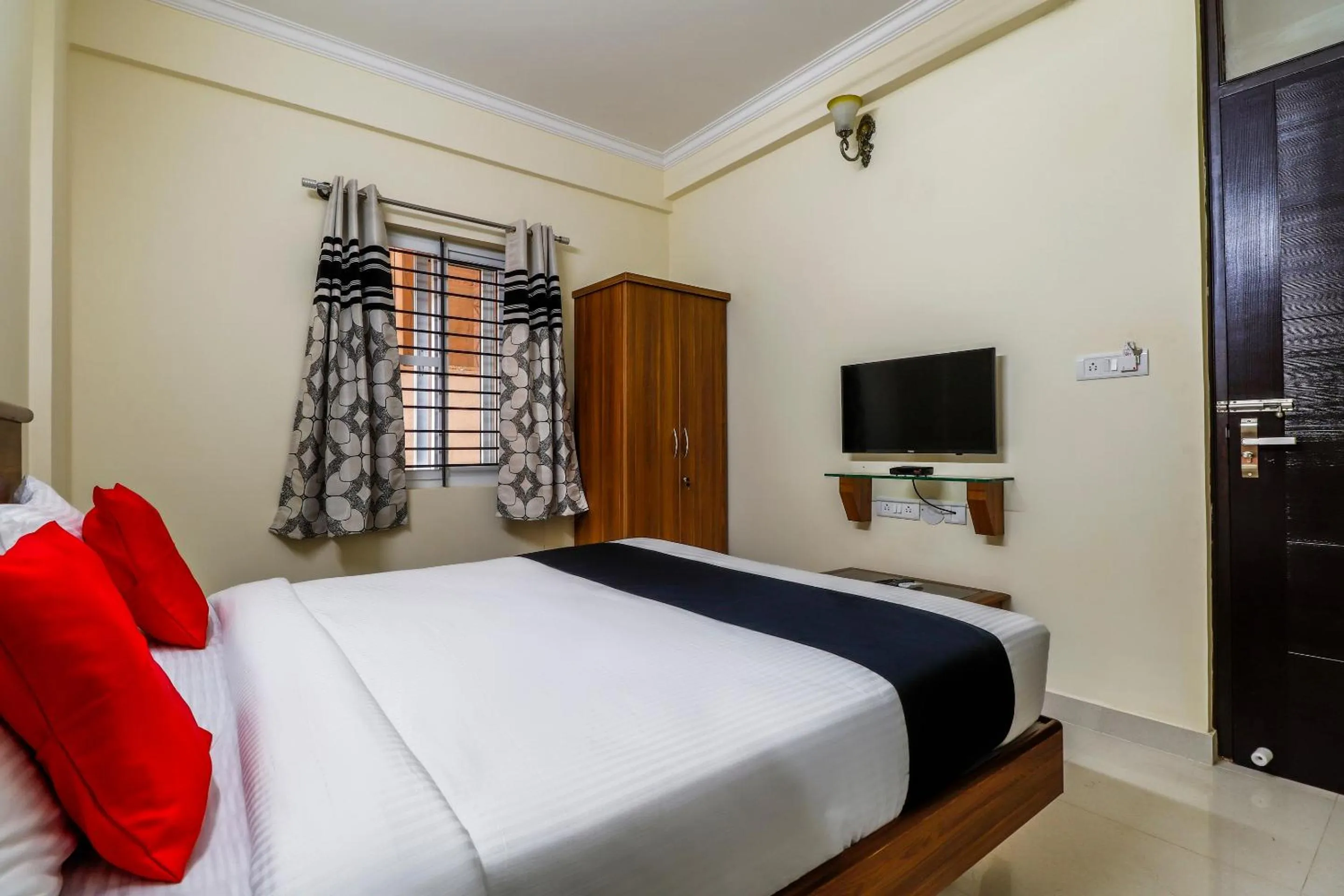Bedroom, Bed in Capital O SLN Residency
