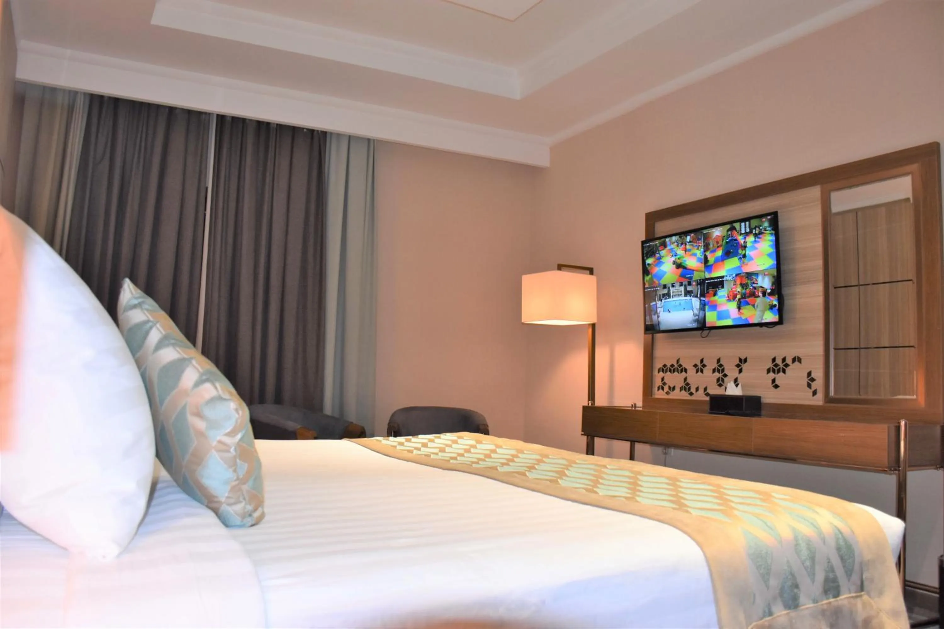 Communal lounge/ TV room, Bed in Midan Hotel & Suites Al Aziziya