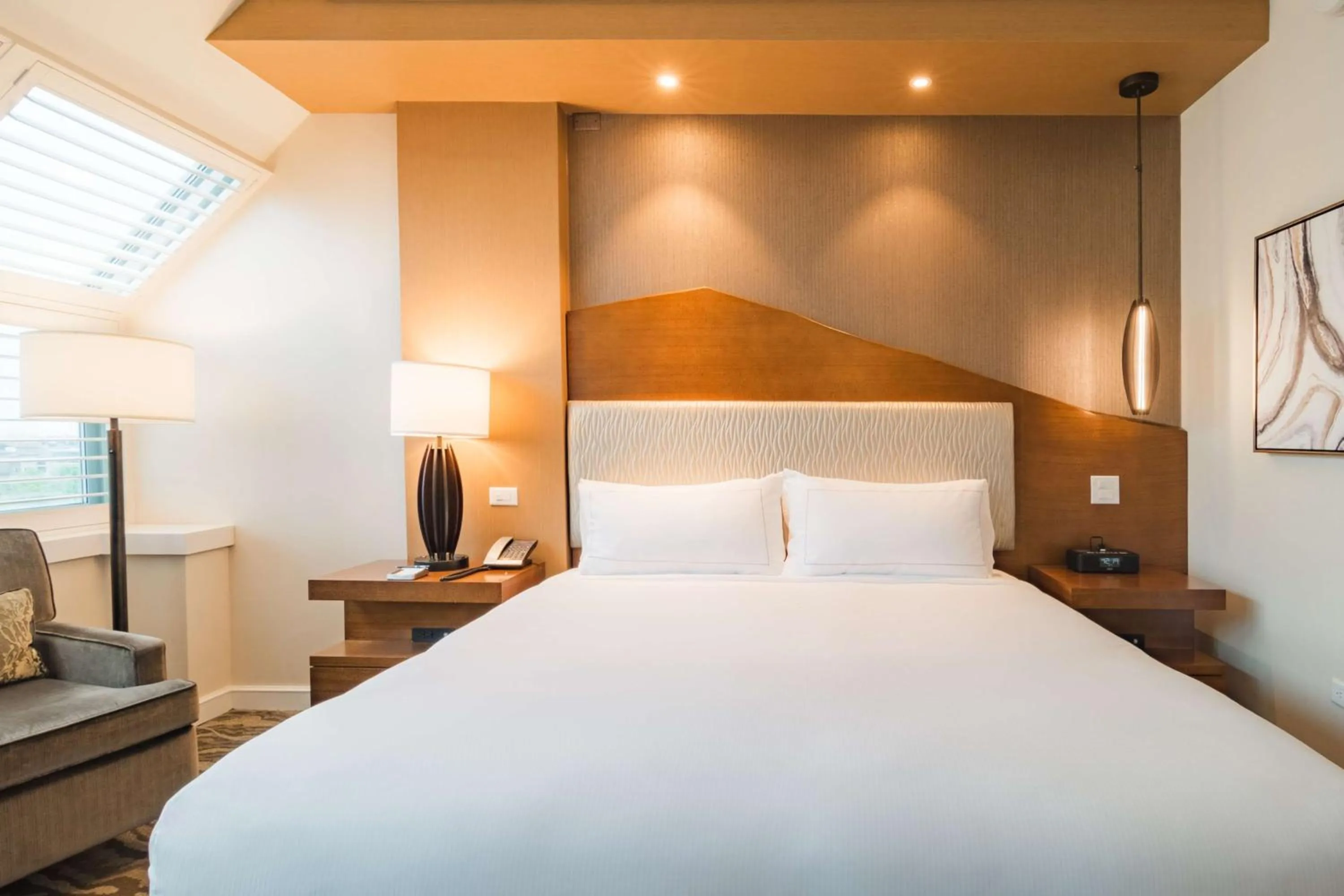 Bed in The Inverness Denver, a Hilton Golf & Spa Resort