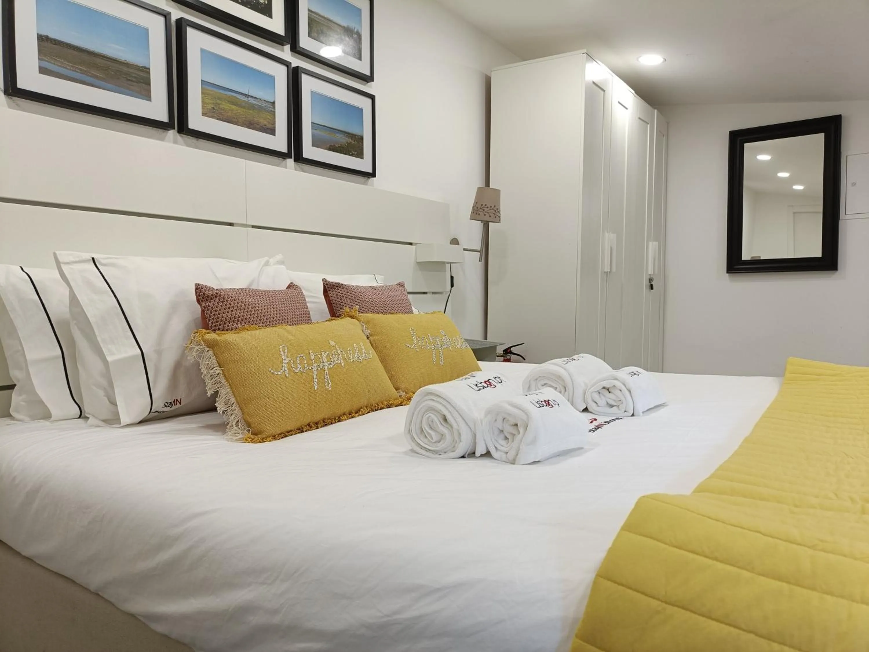 Bed in DoBairro Suites at Merces