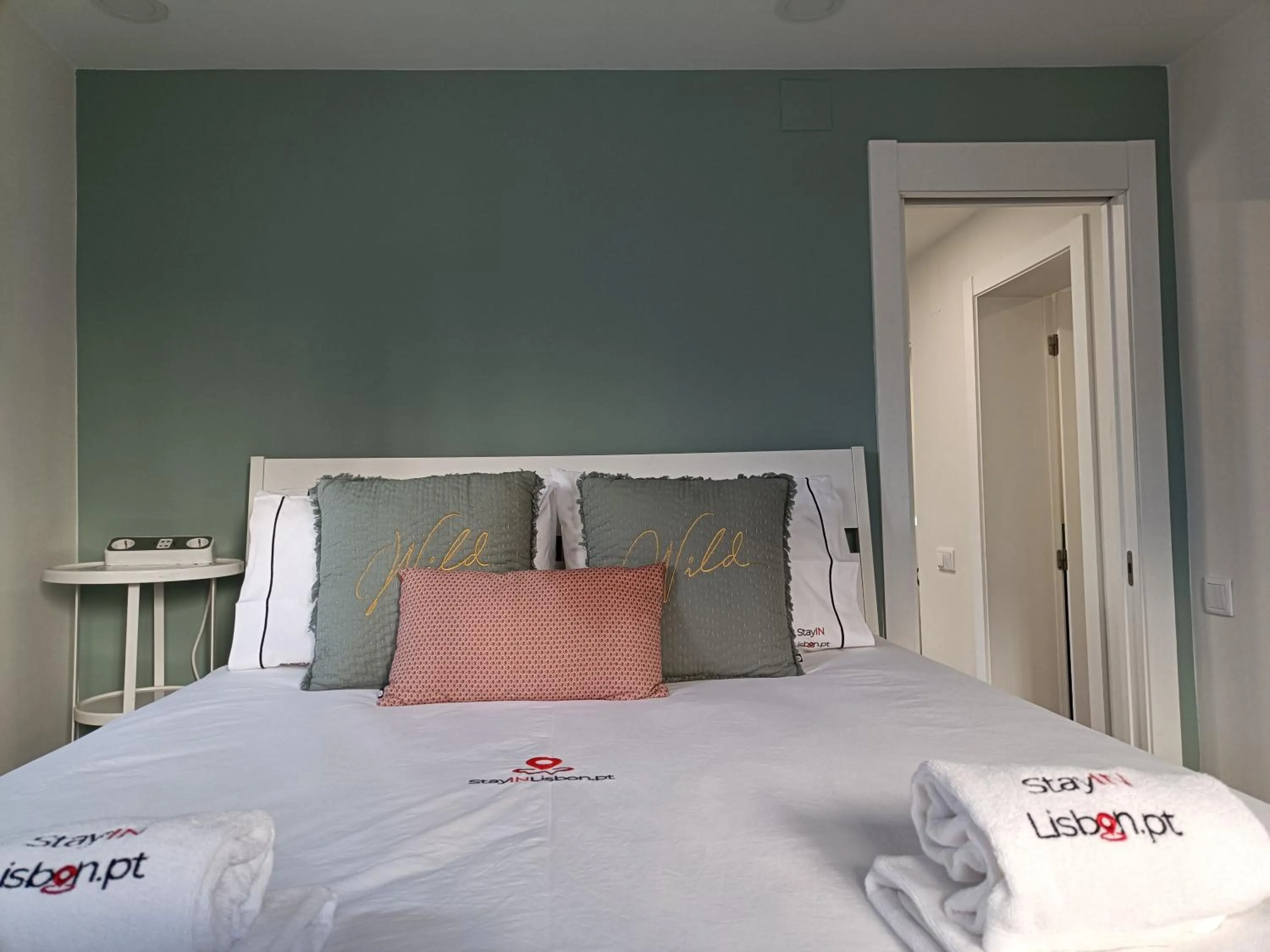 Bed in DoBairro Suites at Merces