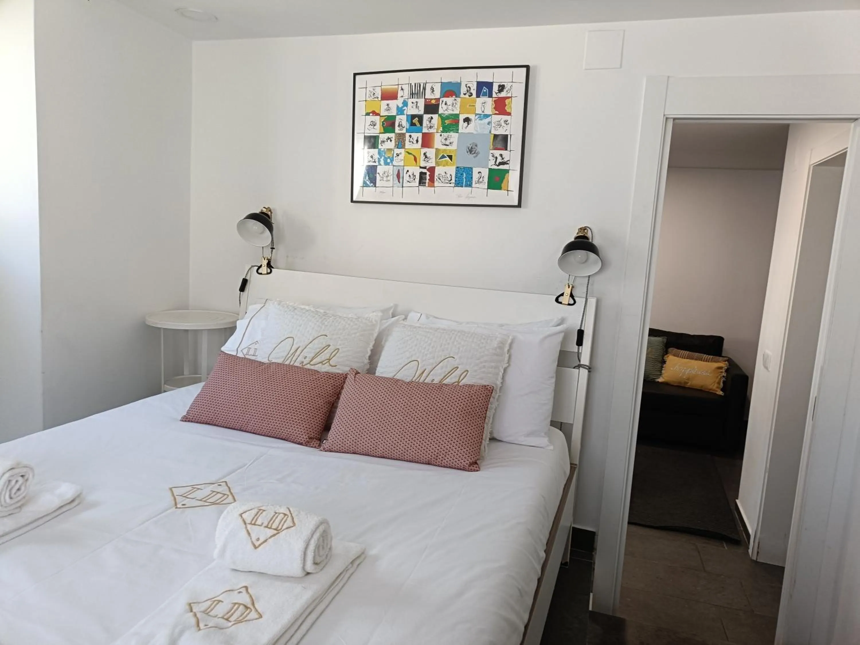 Bed in DoBairro Suites at Merces