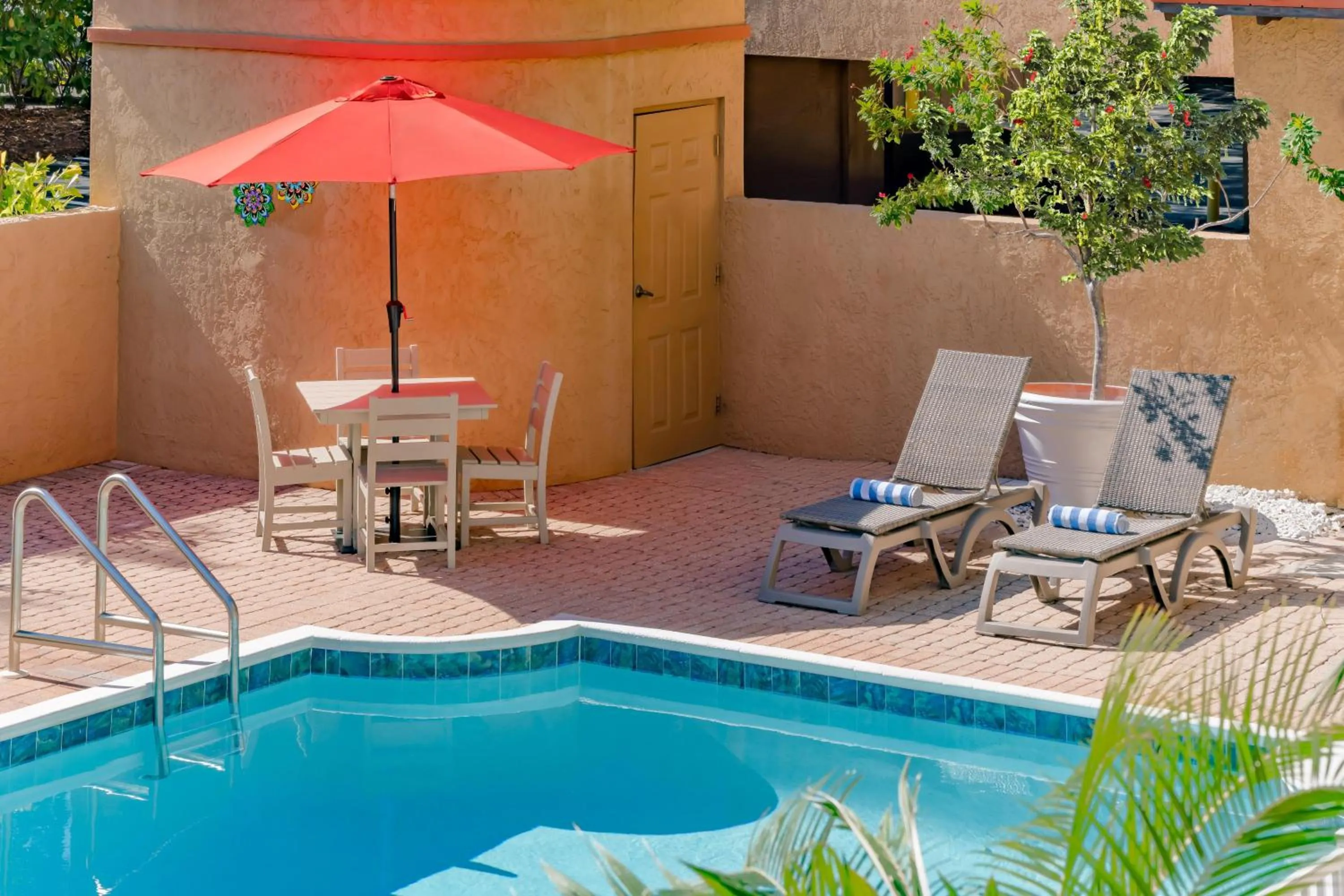Pool view in Inn of Naples, Tapestry Collection by Hilton