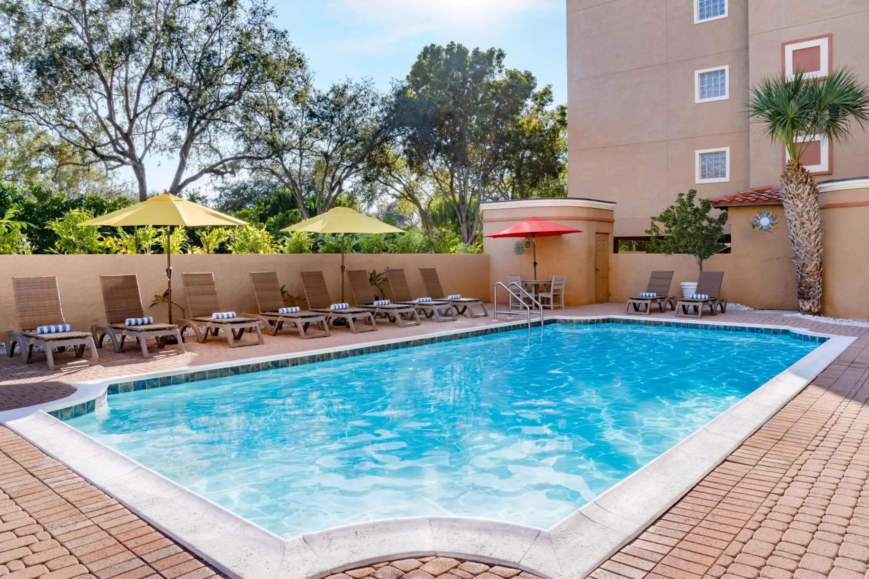 Pool view in Inn of Naples, Tapestry Collection by Hilton