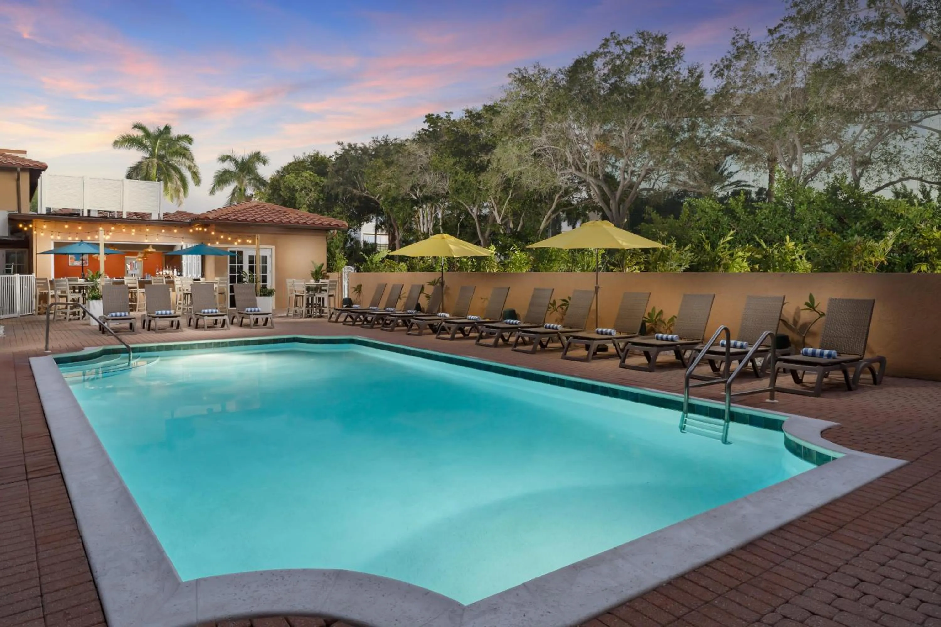 Pool view in Inn of Naples, Tapestry Collection by Hilton