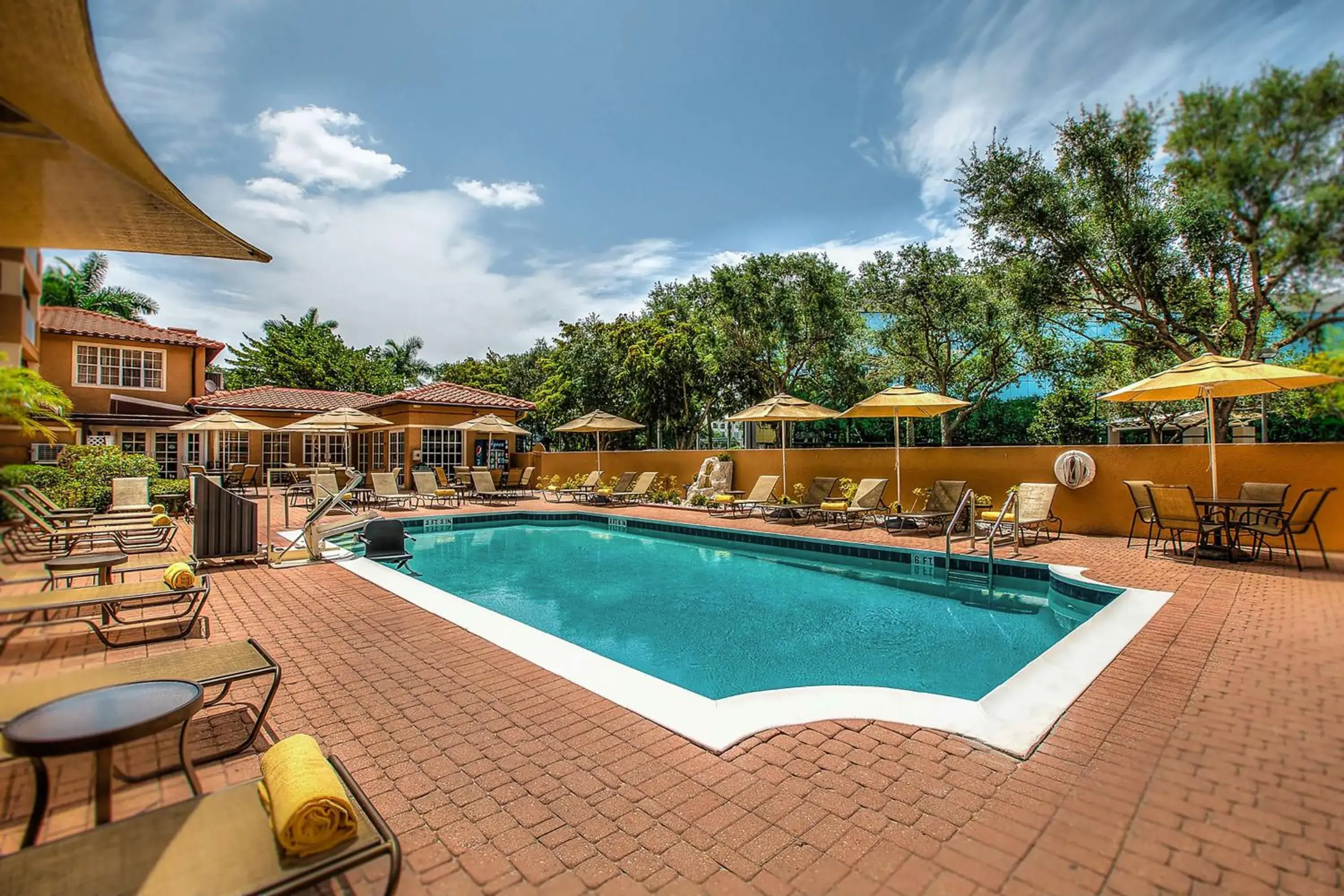 Pool view in Inn of Naples, Tapestry Collection by Hilton Pool view in Inn of Naples, Tapestry Collection by Hilton
