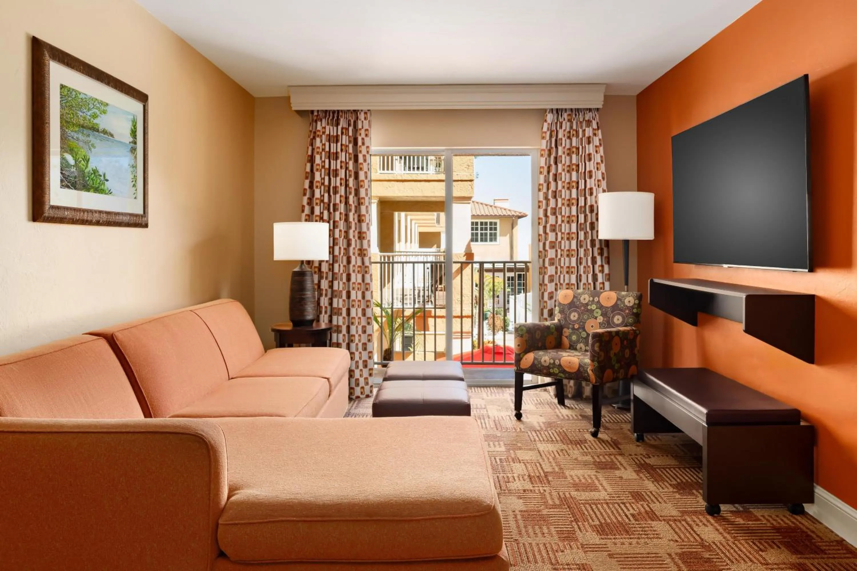 Living room in Inn of Naples, Tapestry Collection by Hilton