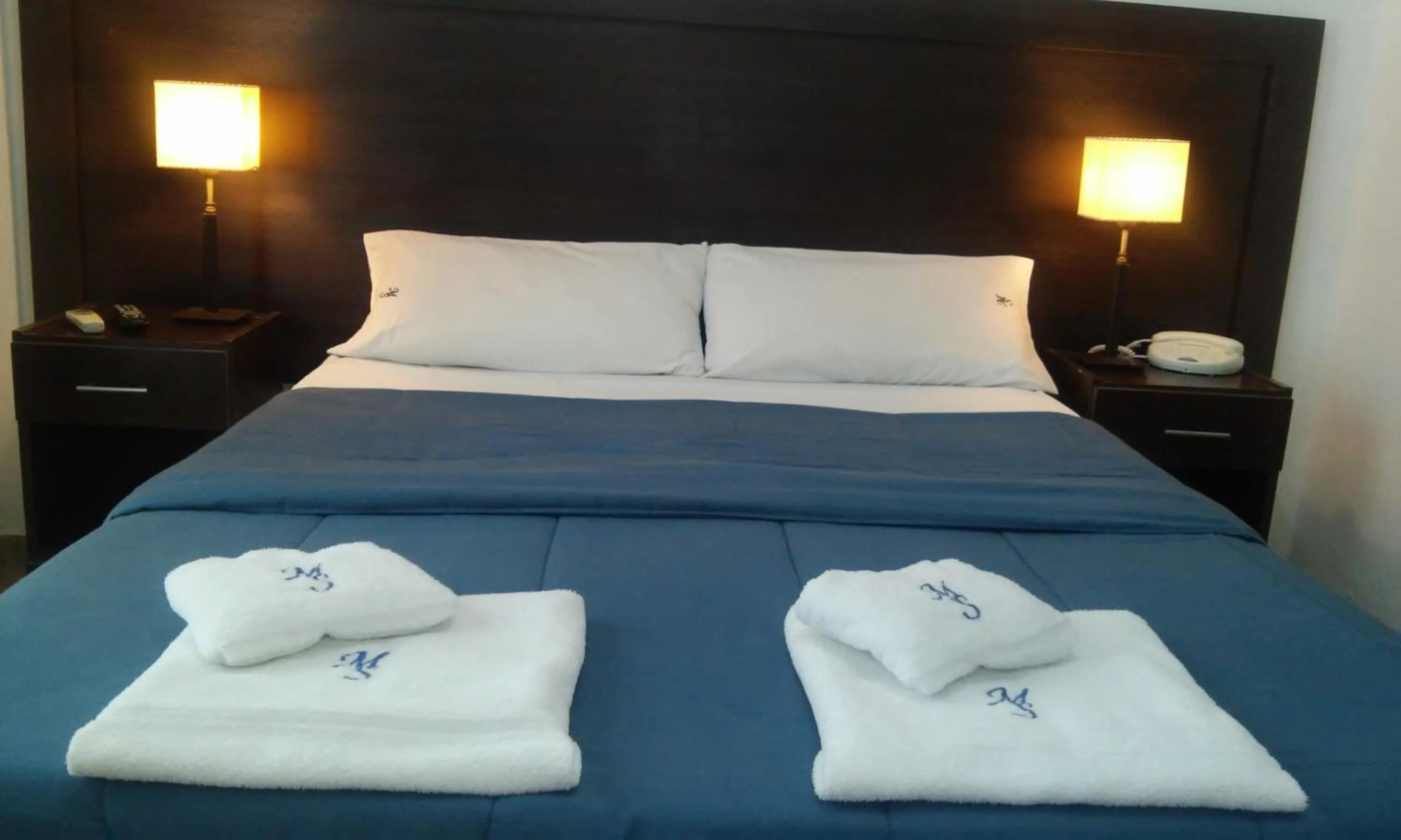 Bed in Morada Suites
