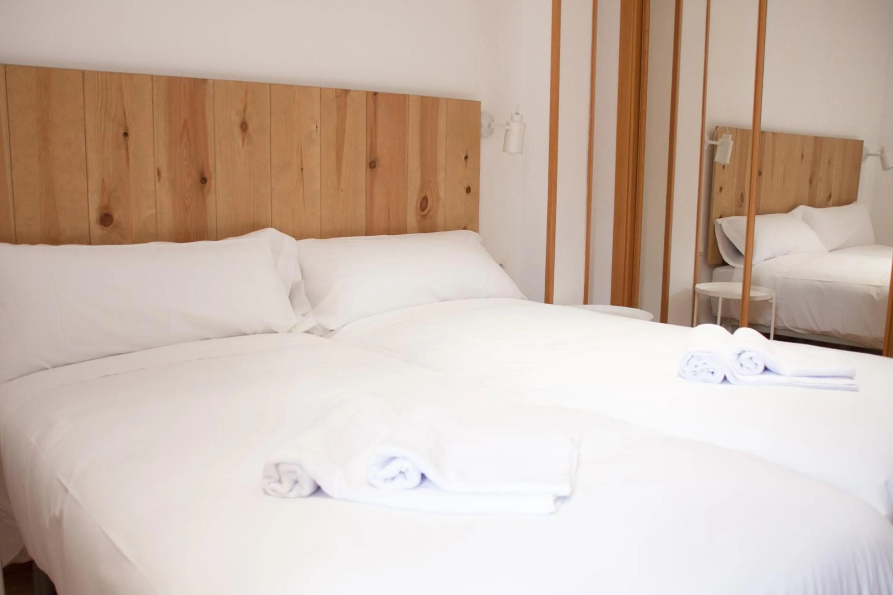 Bed in Hostal Cuéntame Evolución Auto Check in