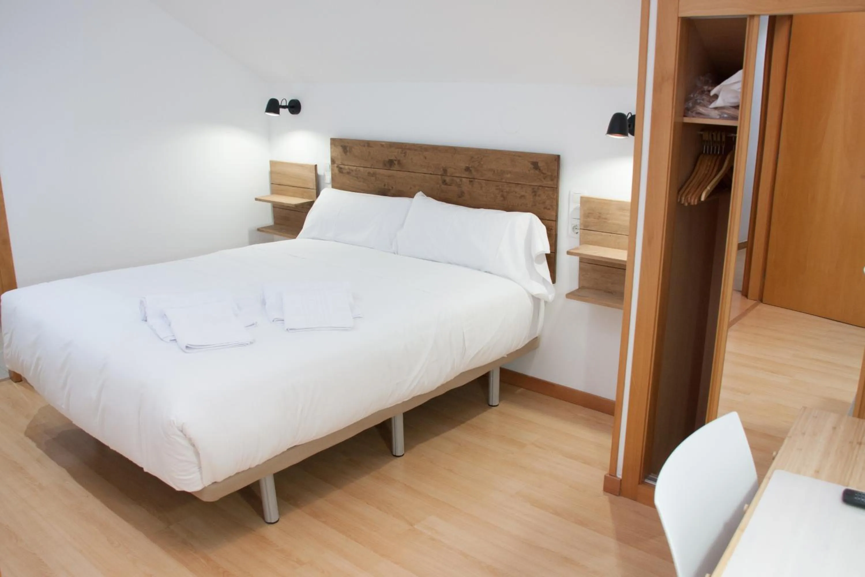 Bed in Hostal Cuéntame Evolución Auto Check in