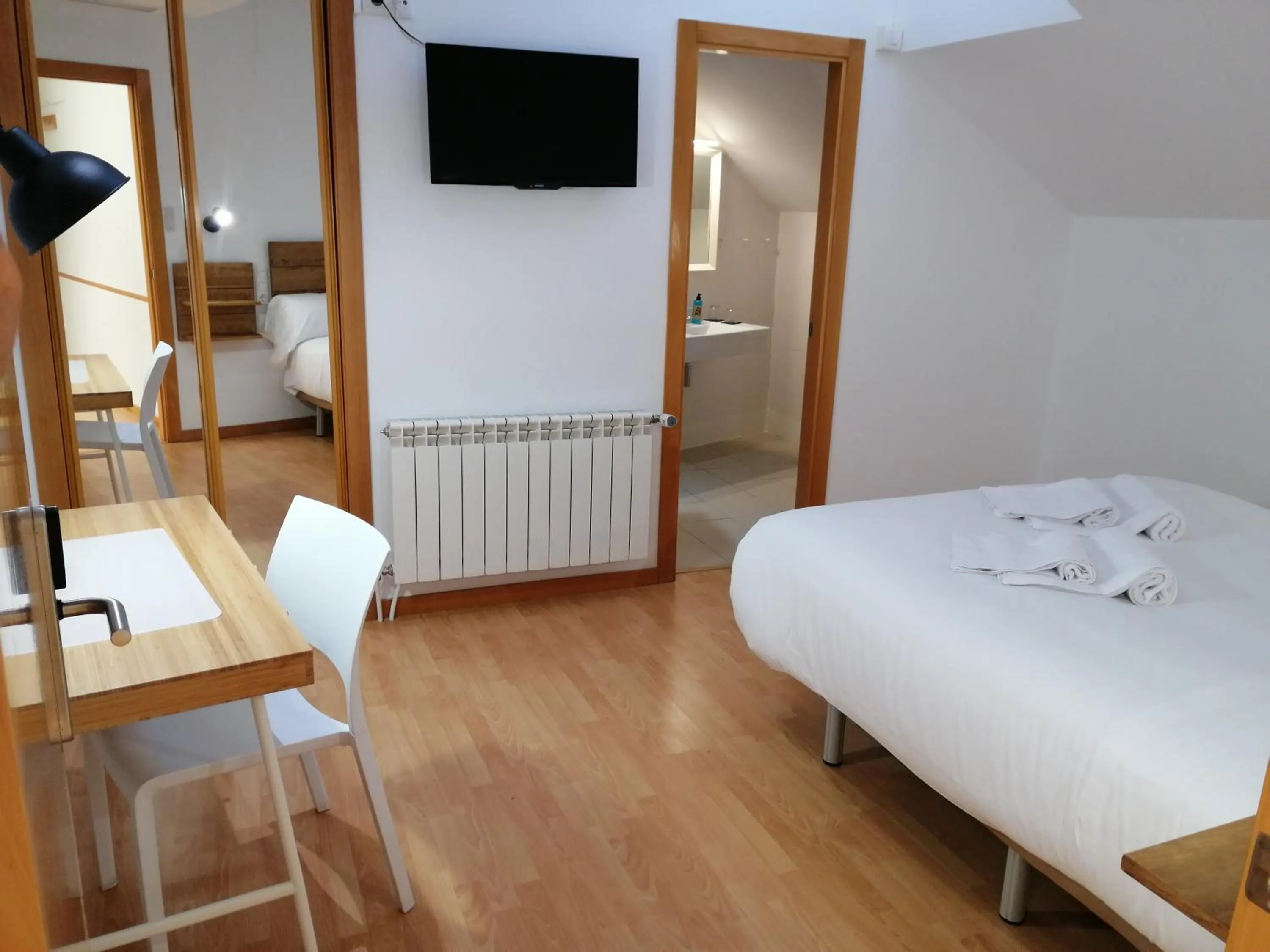 Bed in Hostal Cuéntame Evolución Auto Check in