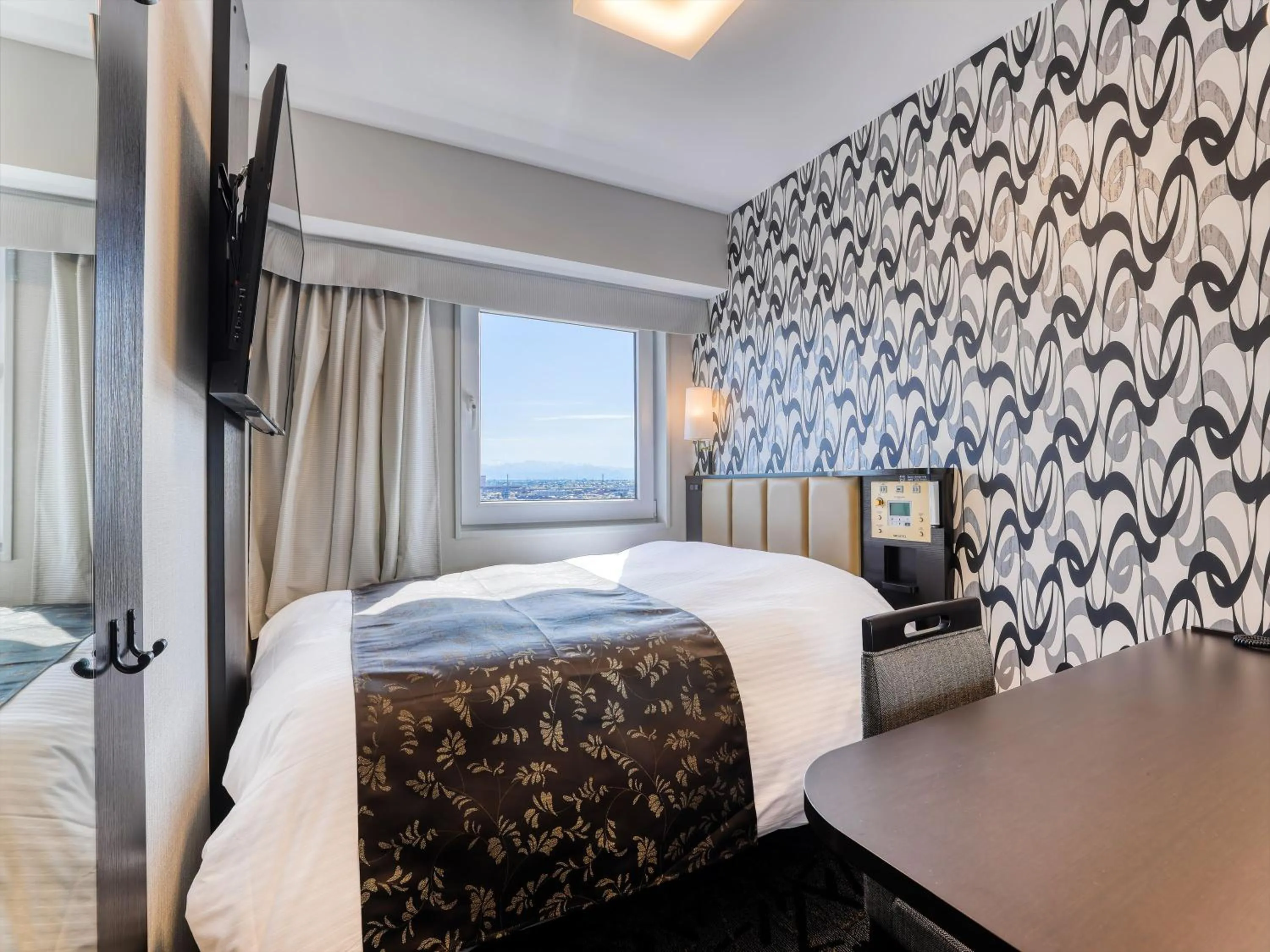 Photo of the whole room, Bed in APA Hotel Takaoka Ekimae