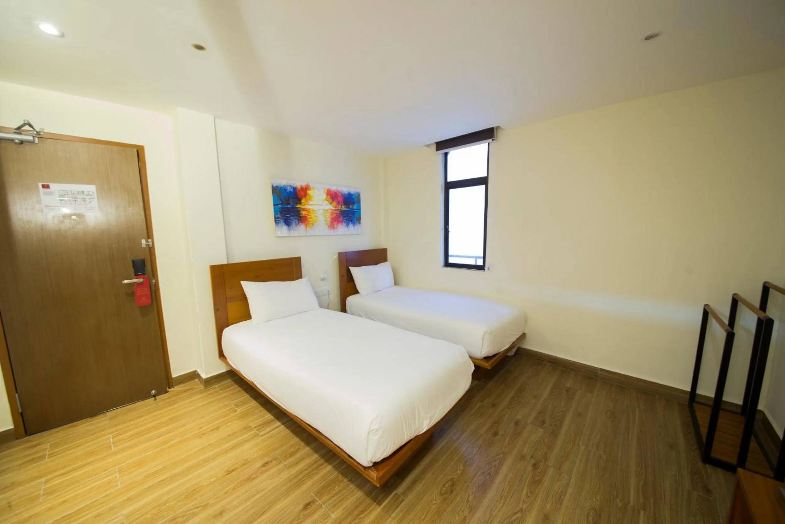 Bed in The Point Boutique Hotel