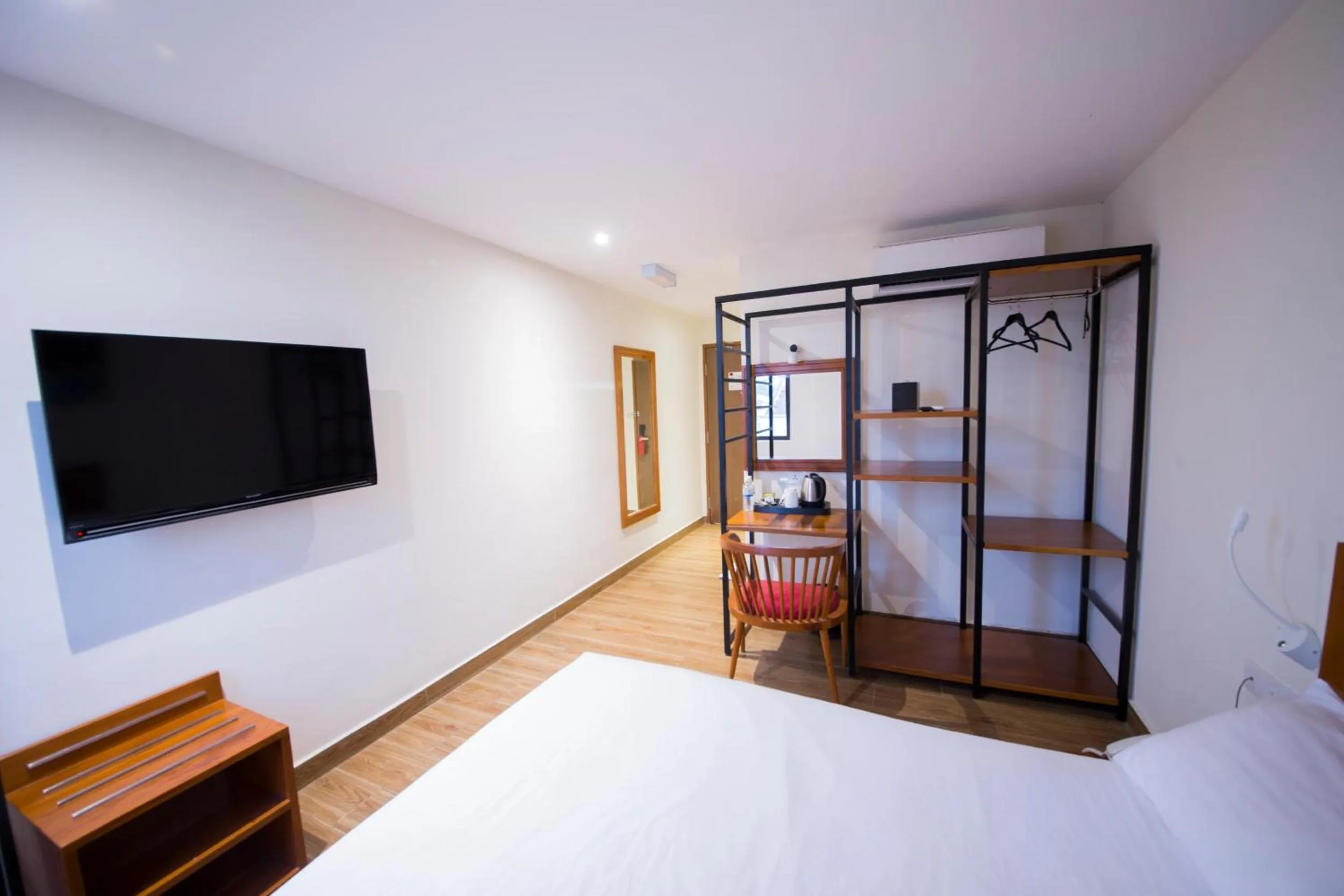 Bed in The Point Boutique Hotel