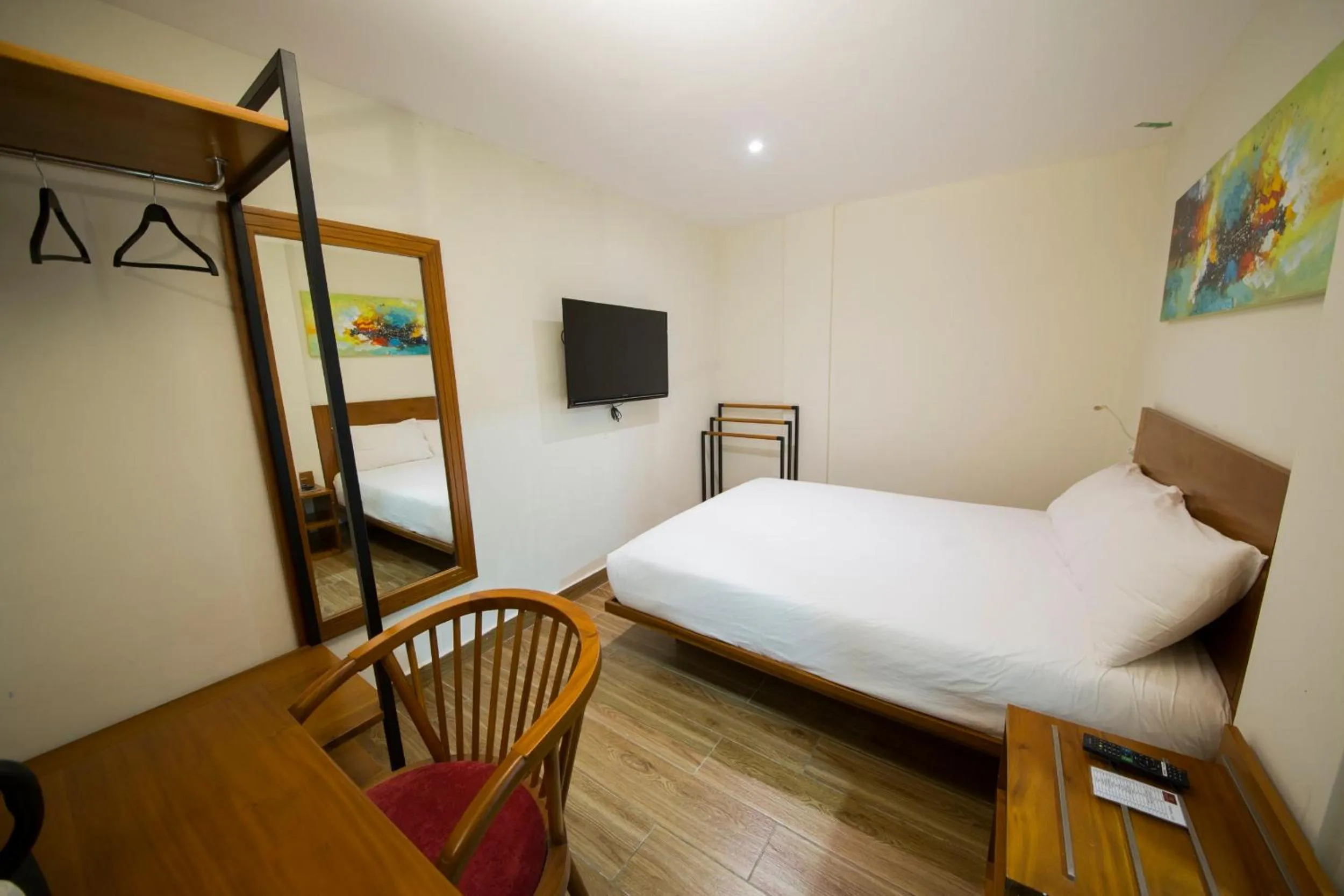 Bed in The Point Boutique Hotel