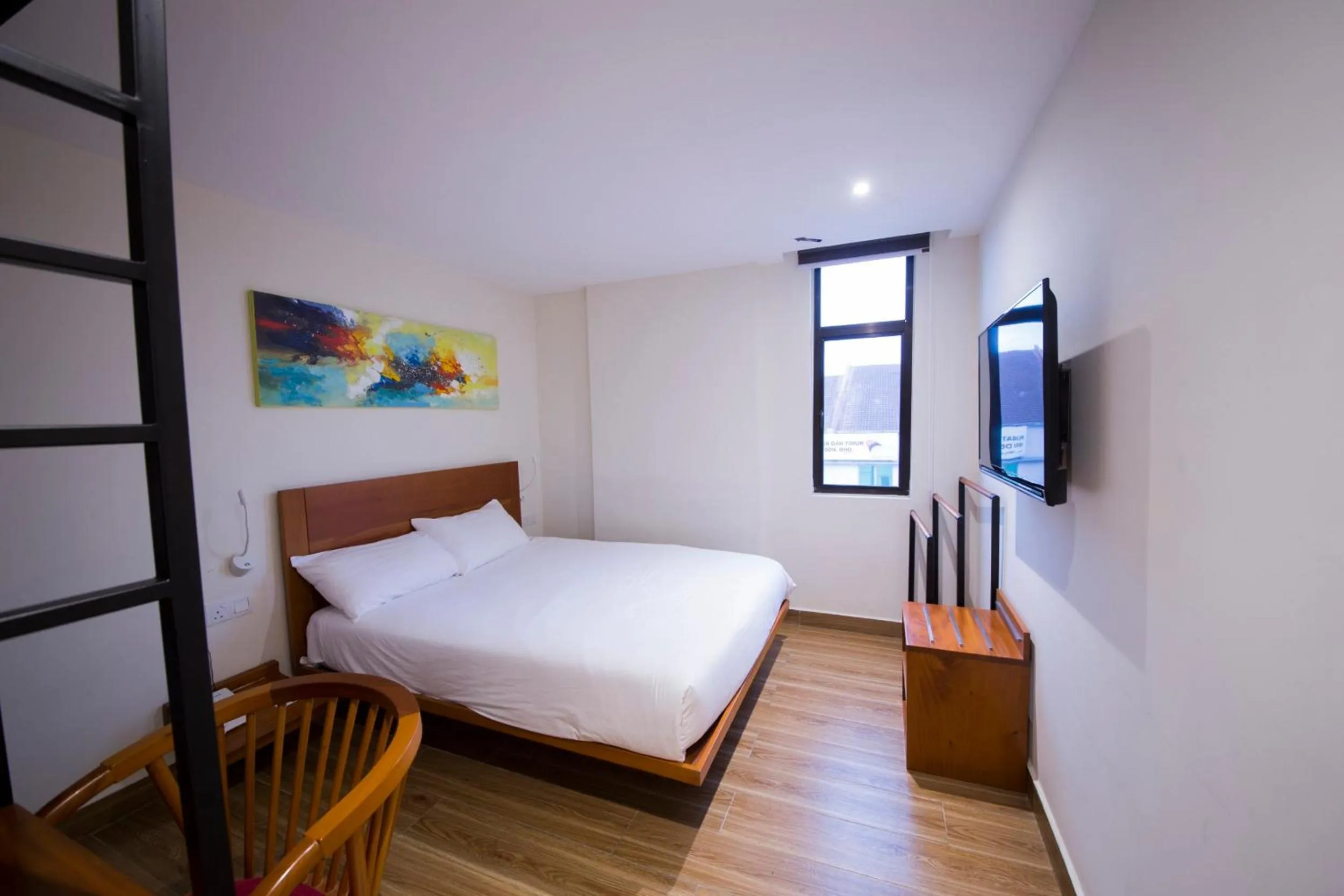 Bed in The Point Boutique Hotel