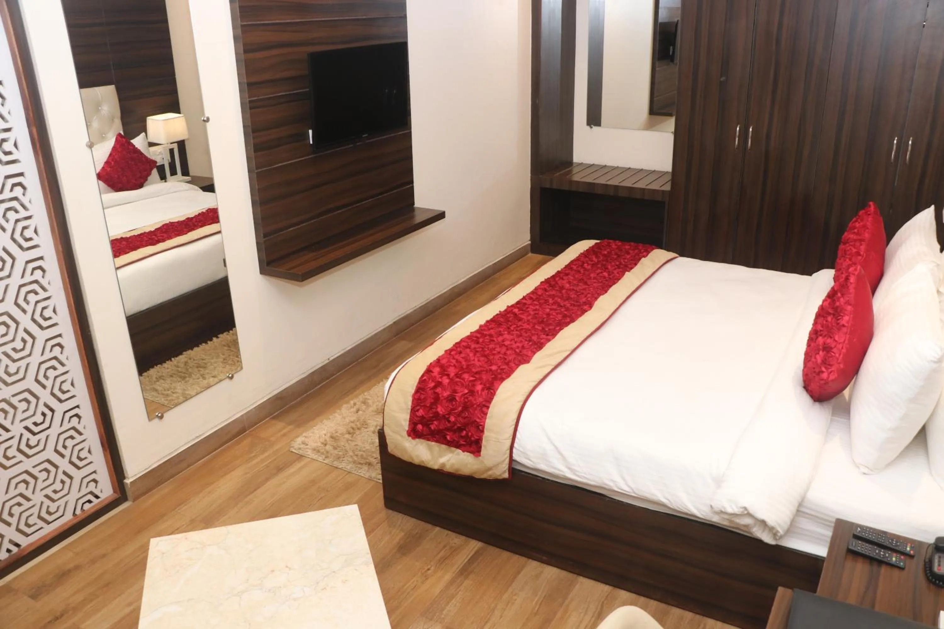 Communal lounge/ TV room, Bed in Comfort Inn Lakhimpur