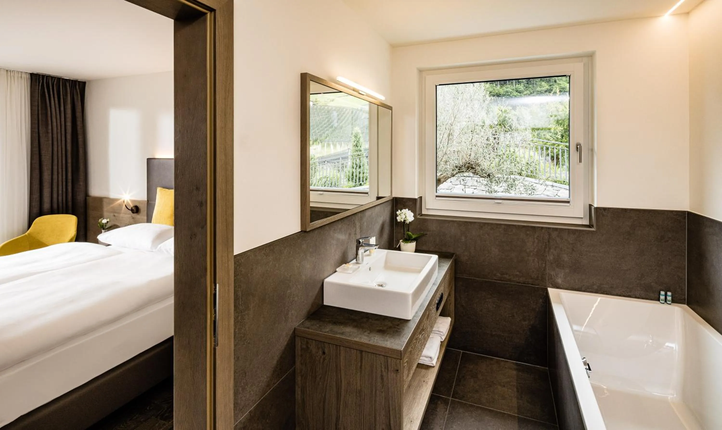 Bathroom, Bed in Panorama Residence Saltauserhof Resort