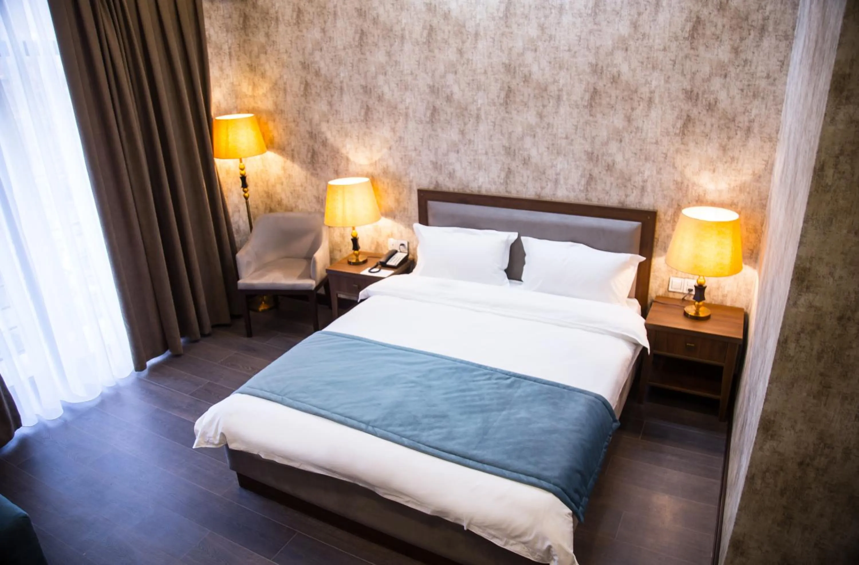 Bed in Macara Sheki City Hotel