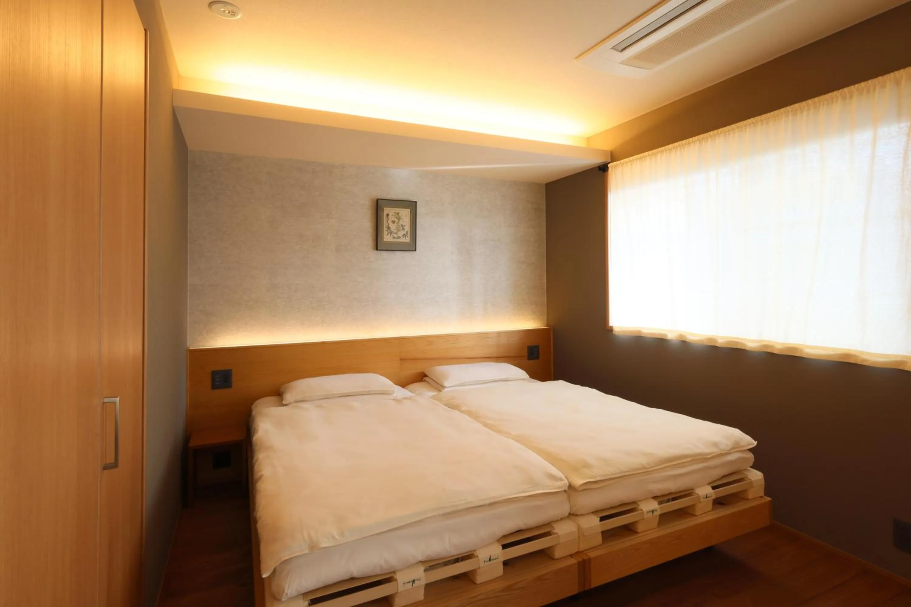 Bed in Neon Hotel - Luxury Sleep Retreat -