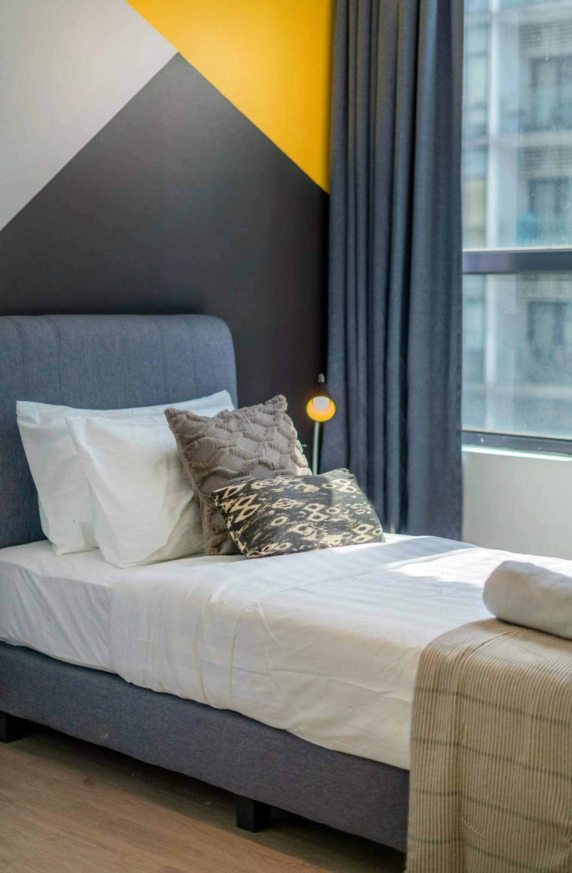 Bed in Arte Plus KLCC Designer Suites by Cobnb