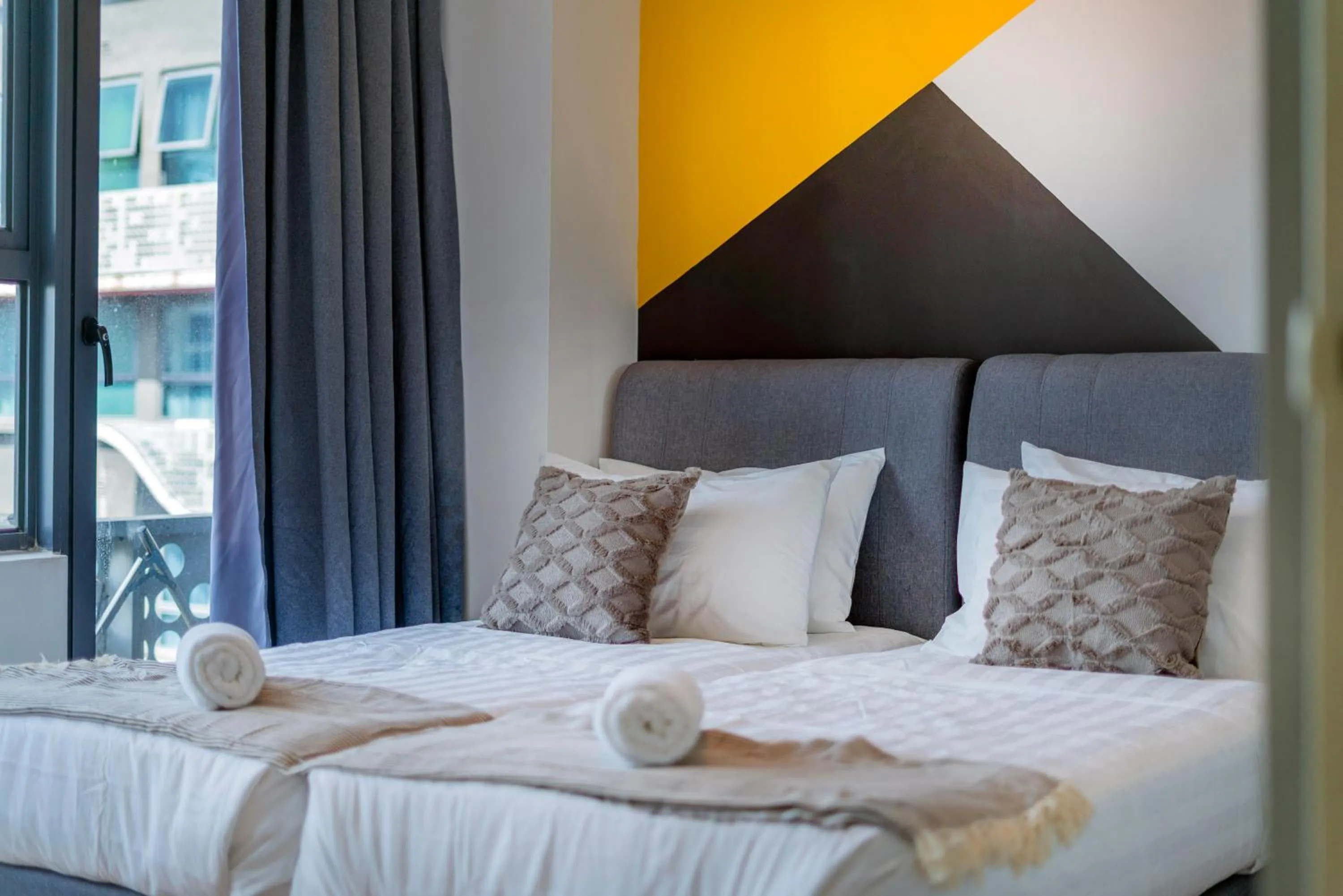 Bed in Arte Plus KLCC Designer Suites by Cobnb