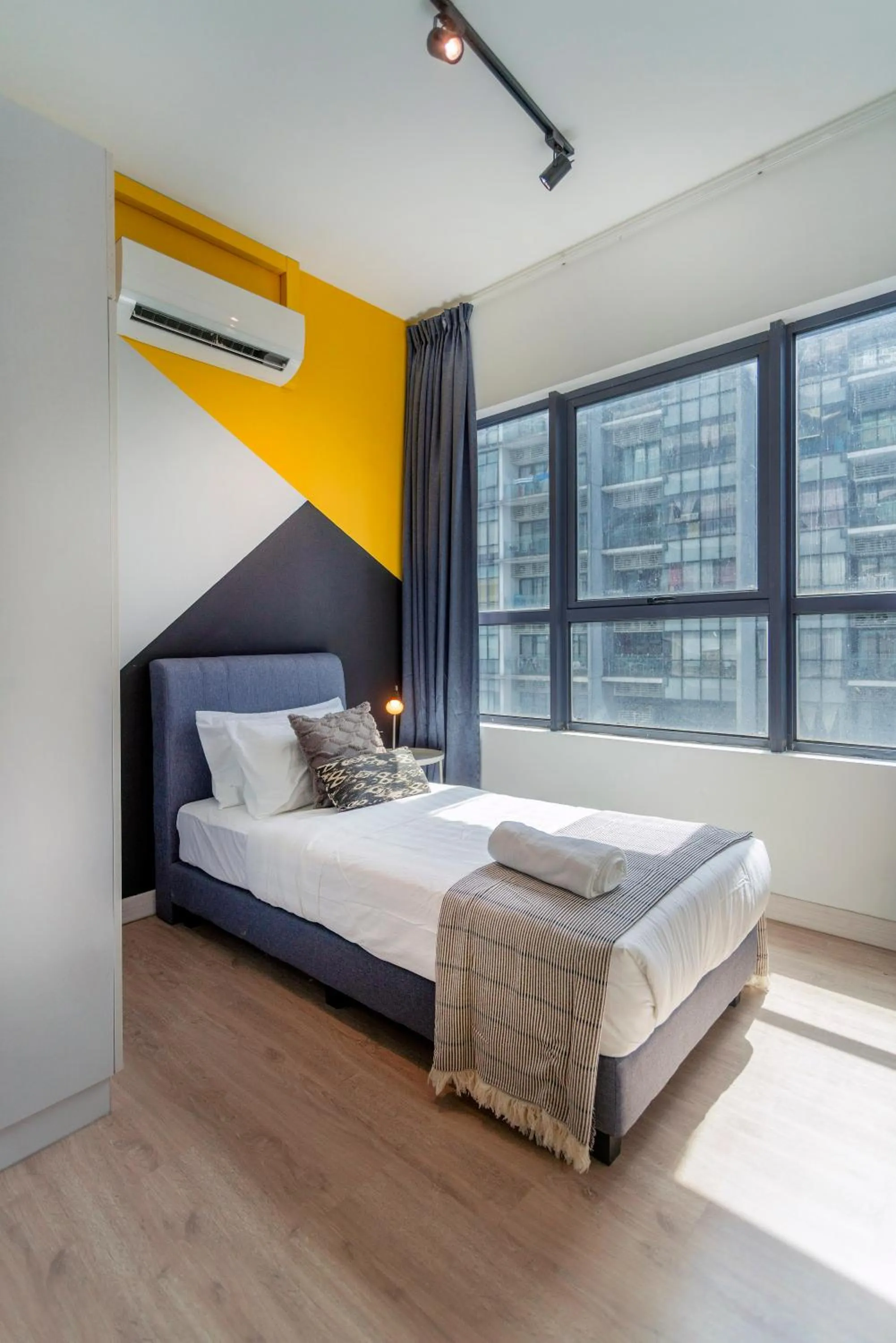 Bed in Arte Plus KLCC Designer Suites by Cobnb