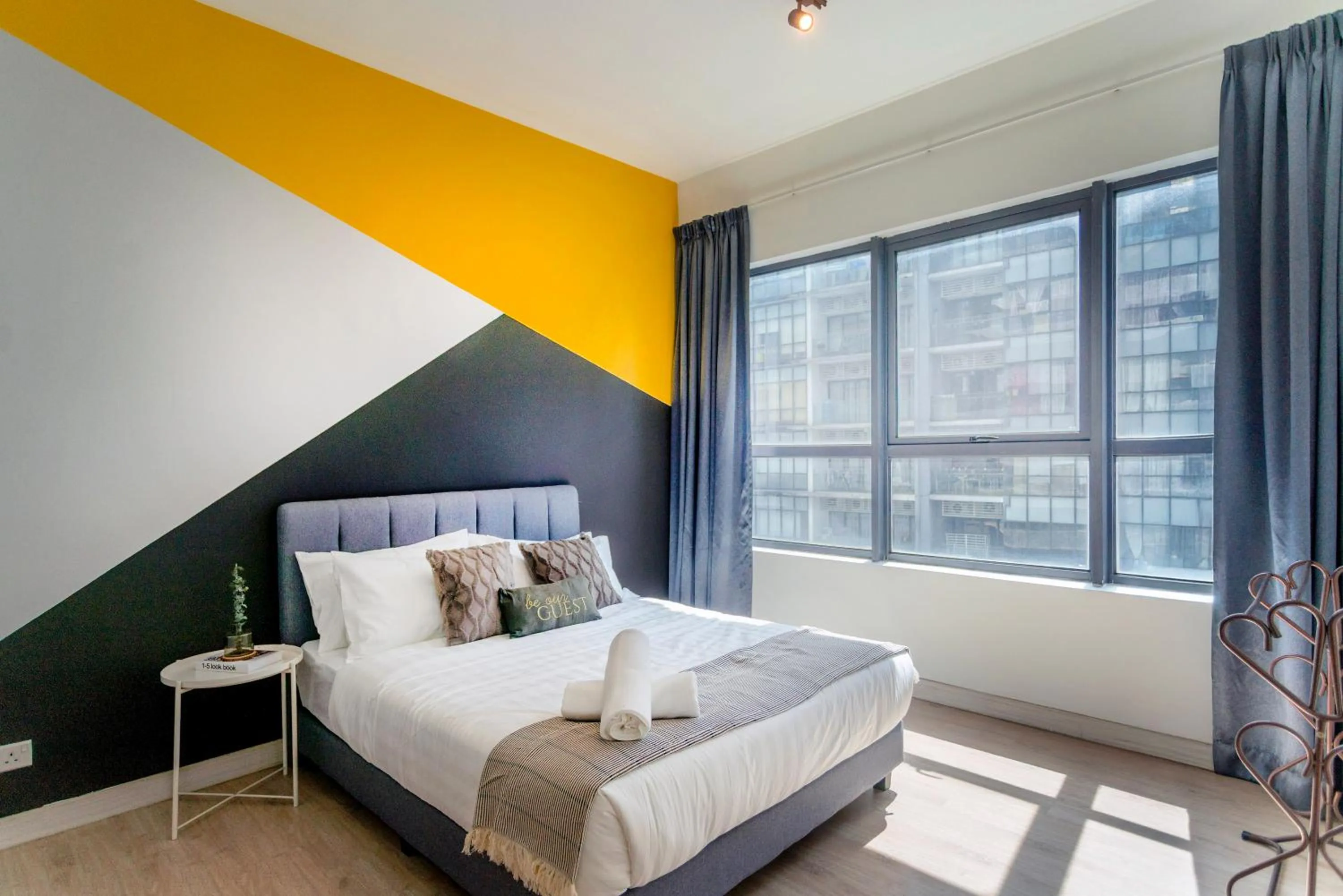 Bed in Arte Plus KLCC Designer Suites by Cobnb