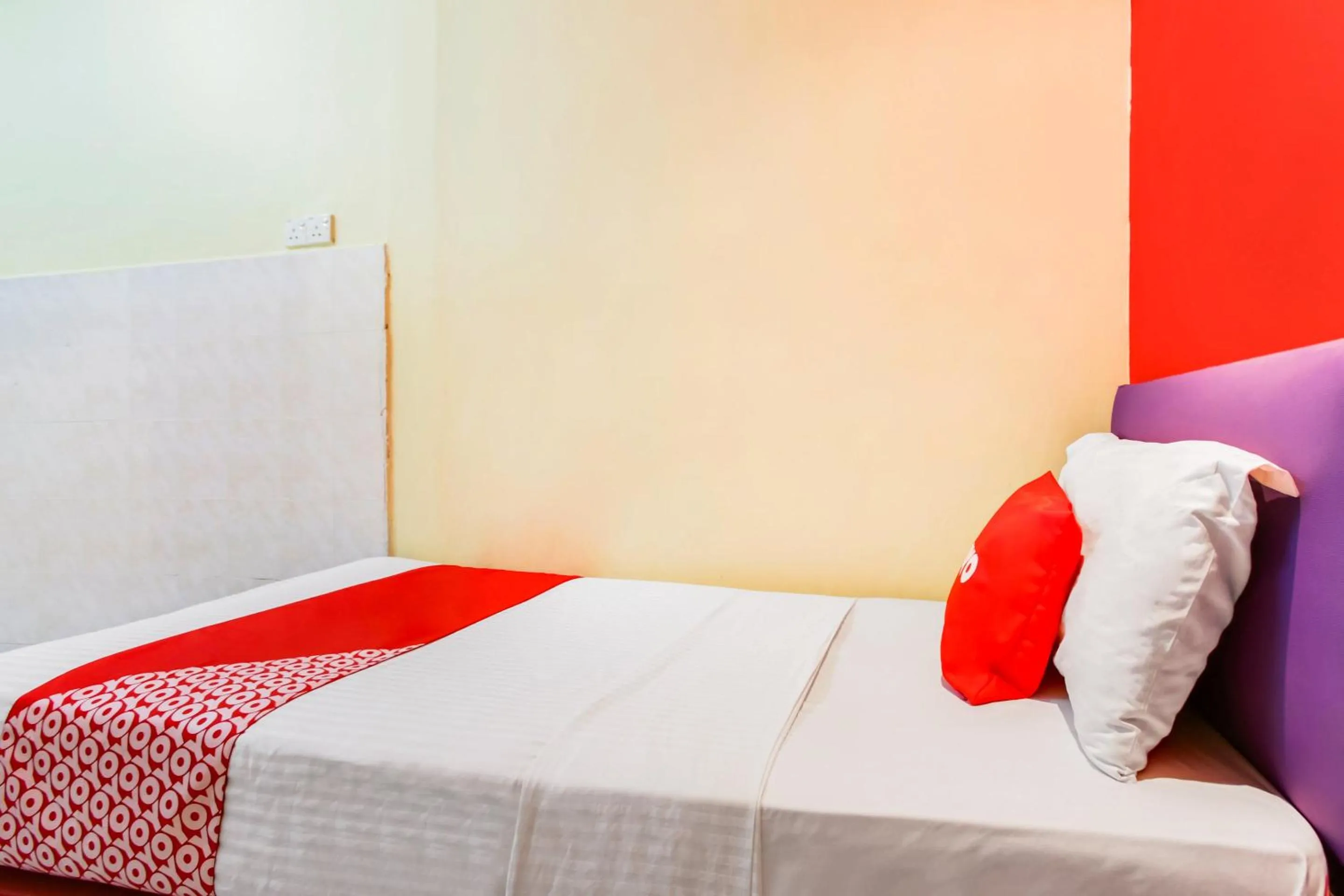 Bedroom in OYO 89615 T Family Hotel