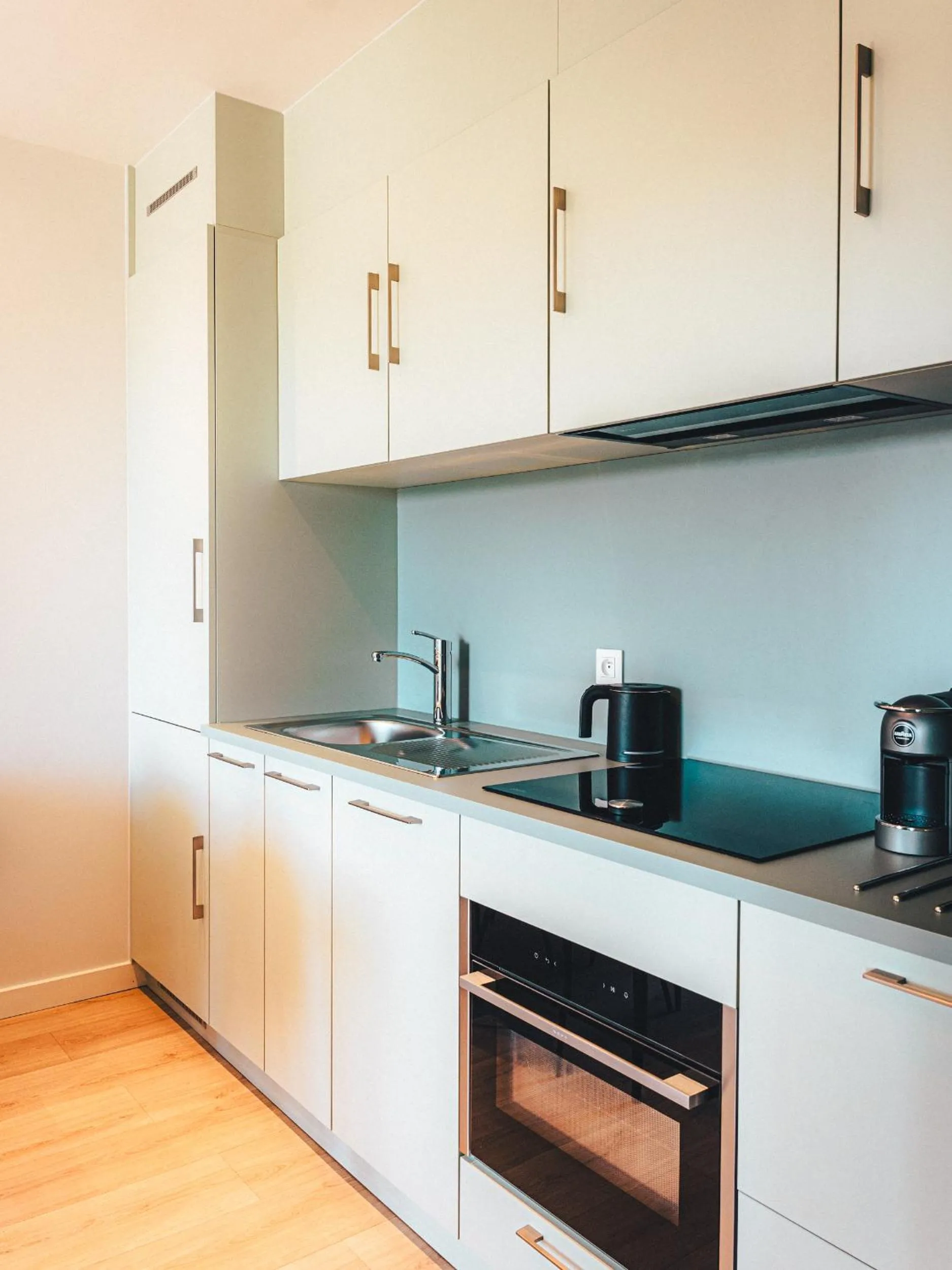 Kitchen or kitchenette in Le Suffren Hôtel