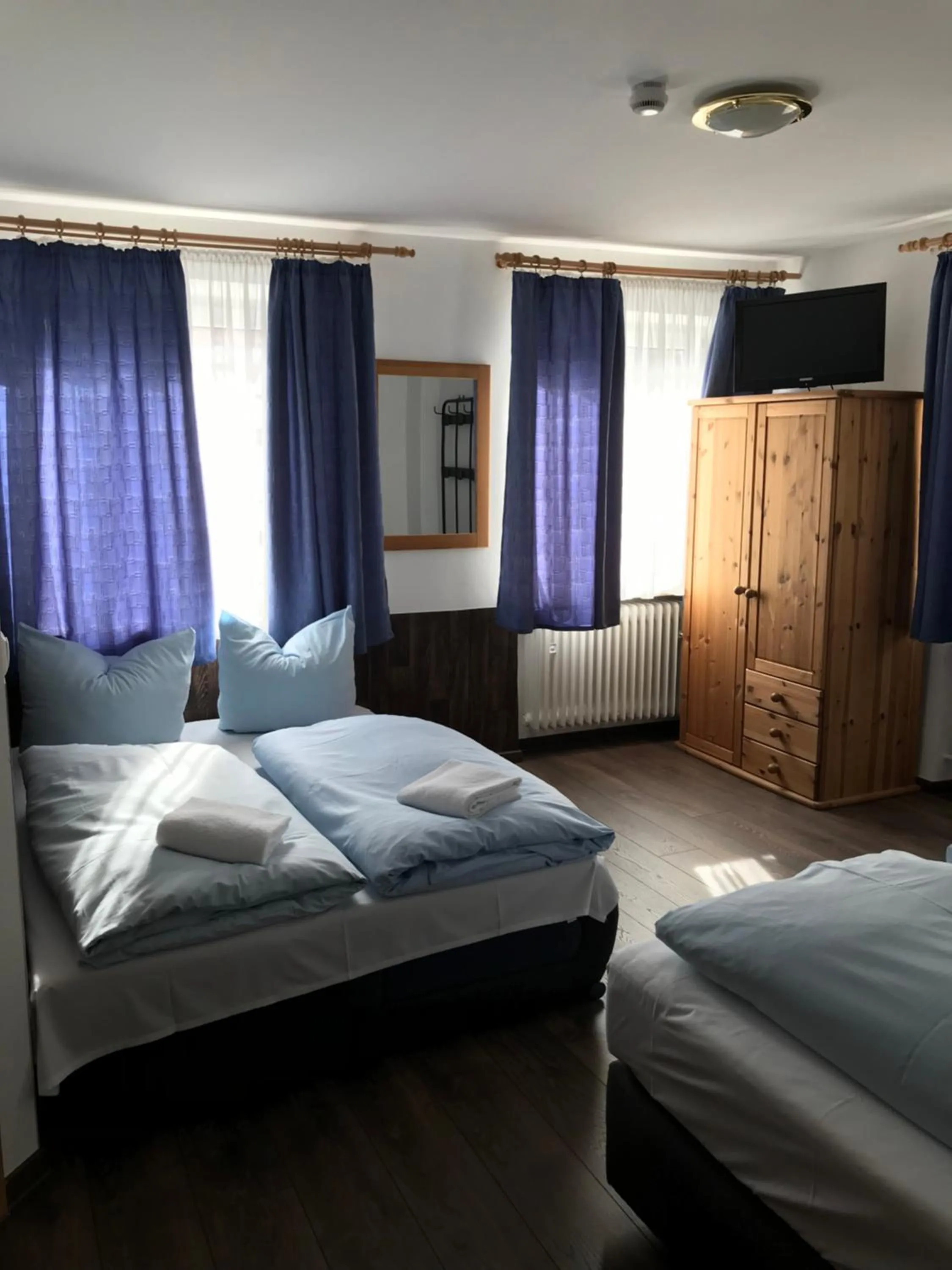Bed in Hotel Guntia Boardinghouse virtueller check in und Zimmer Zugang