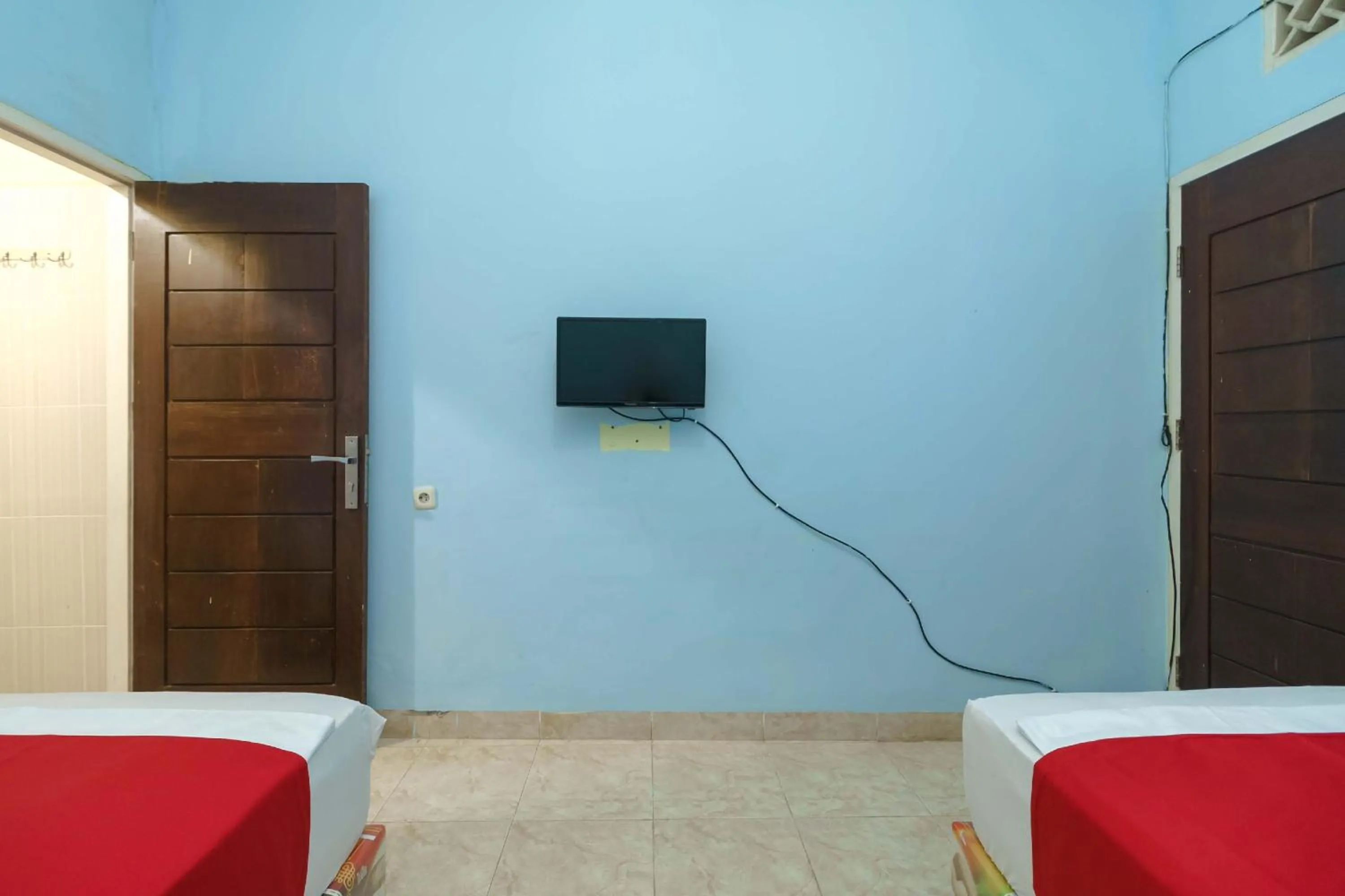 Bedroom, Bed in RedDoorz Syariah @ Mora Garden Bungo