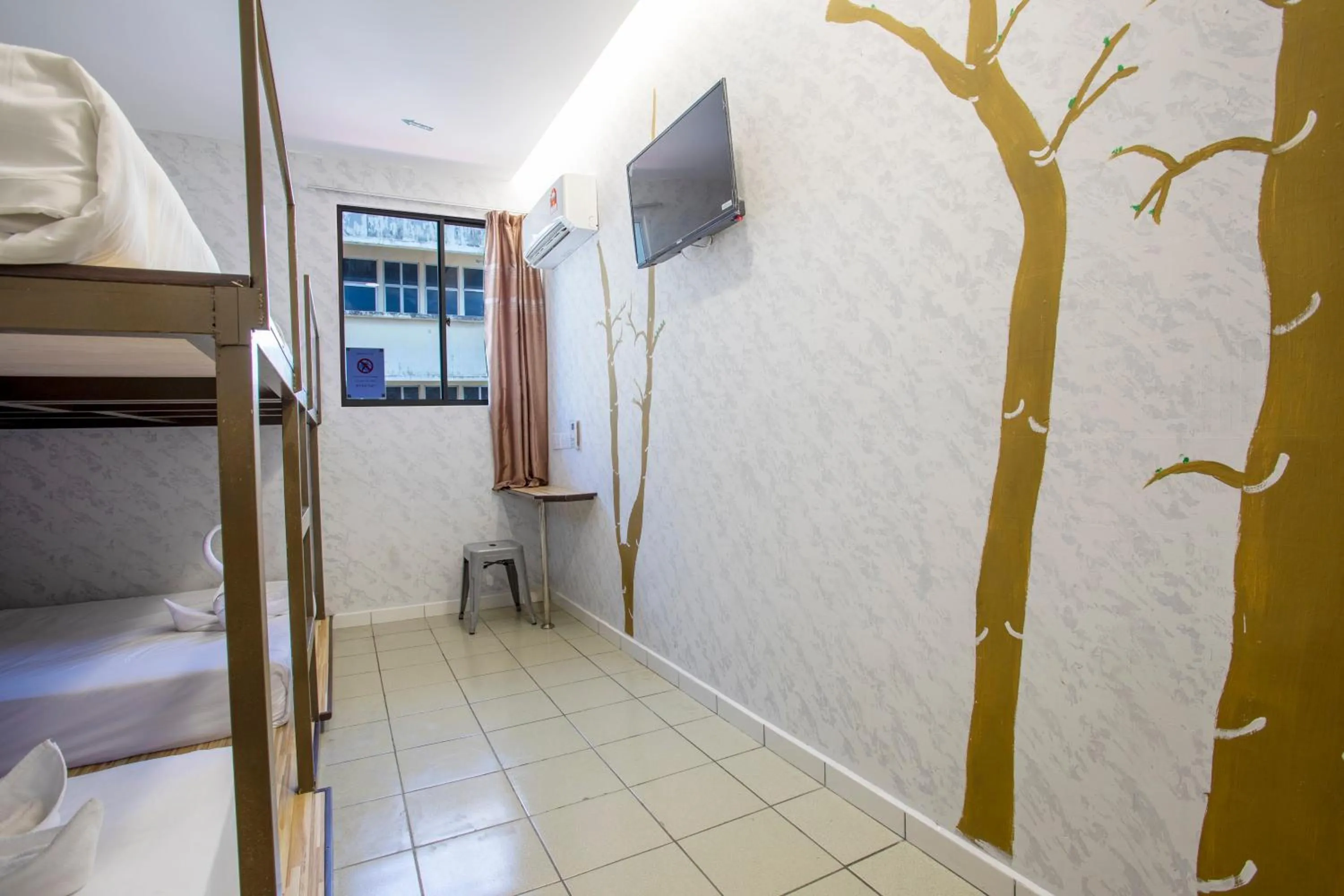 Bed in Lazy Cat Home At Gaya Street