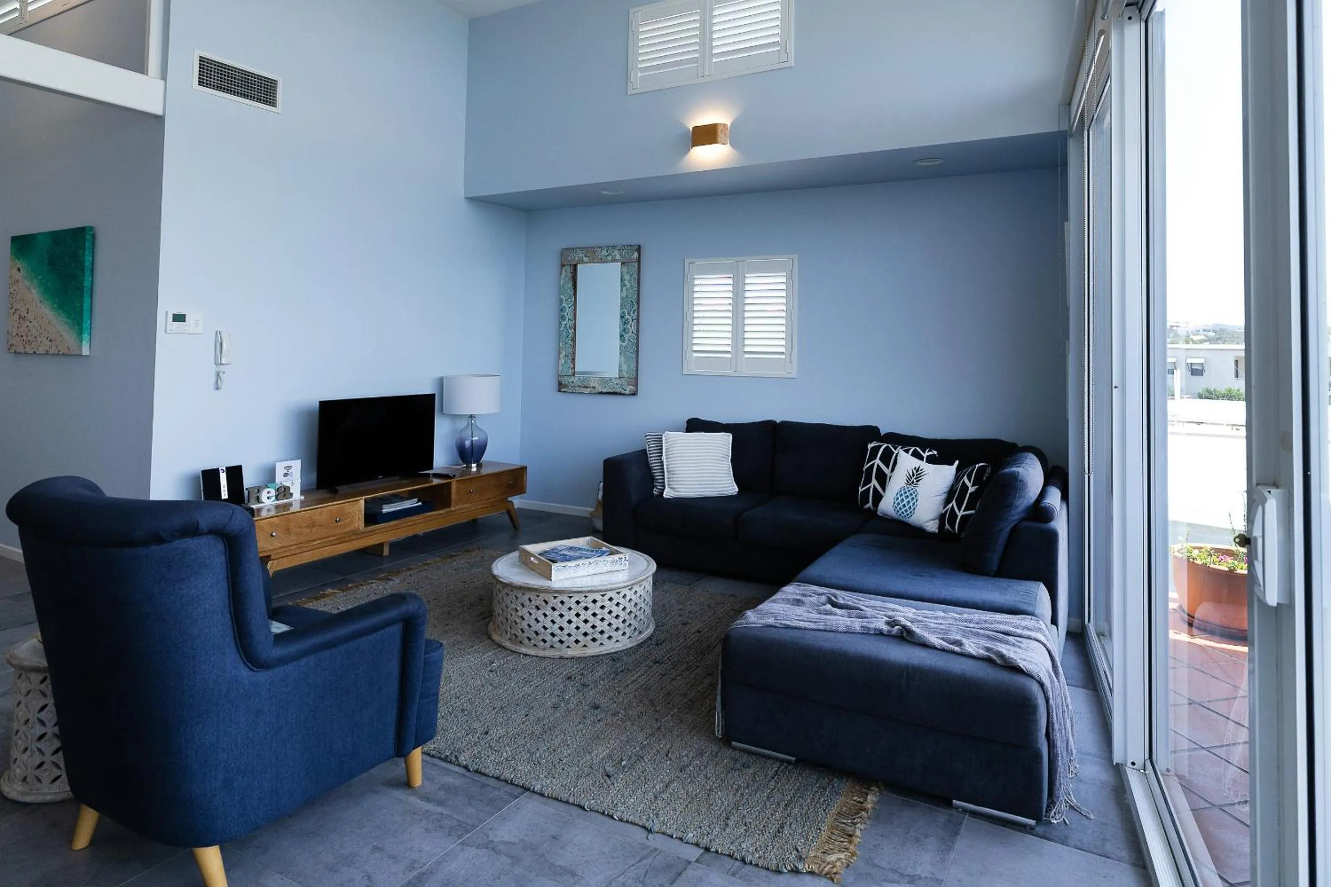 Living room in Aqua Promenade Beachfront Holiday Apartments