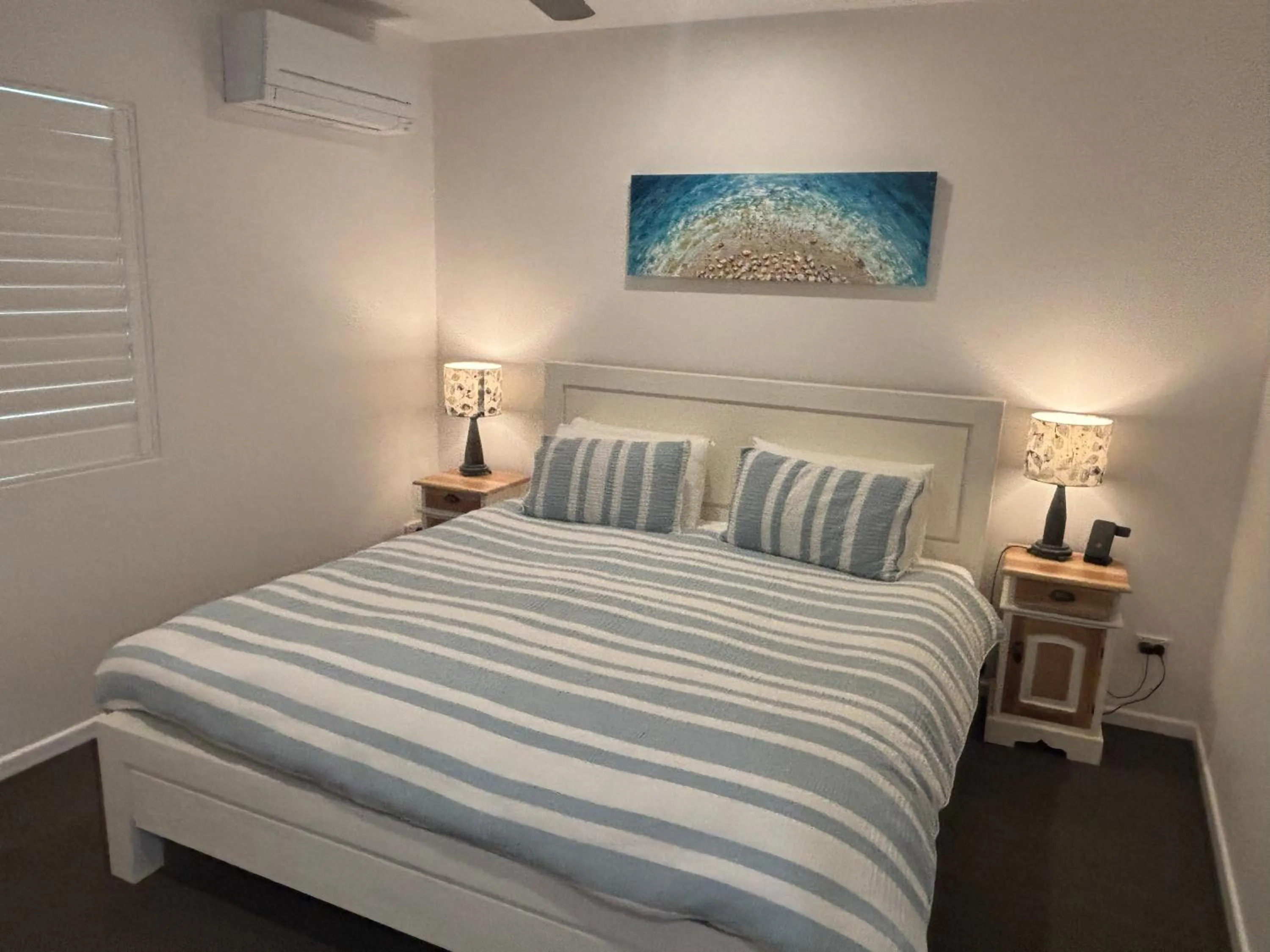 Bed in Aqua Promenade Beachfront Holiday Apartments