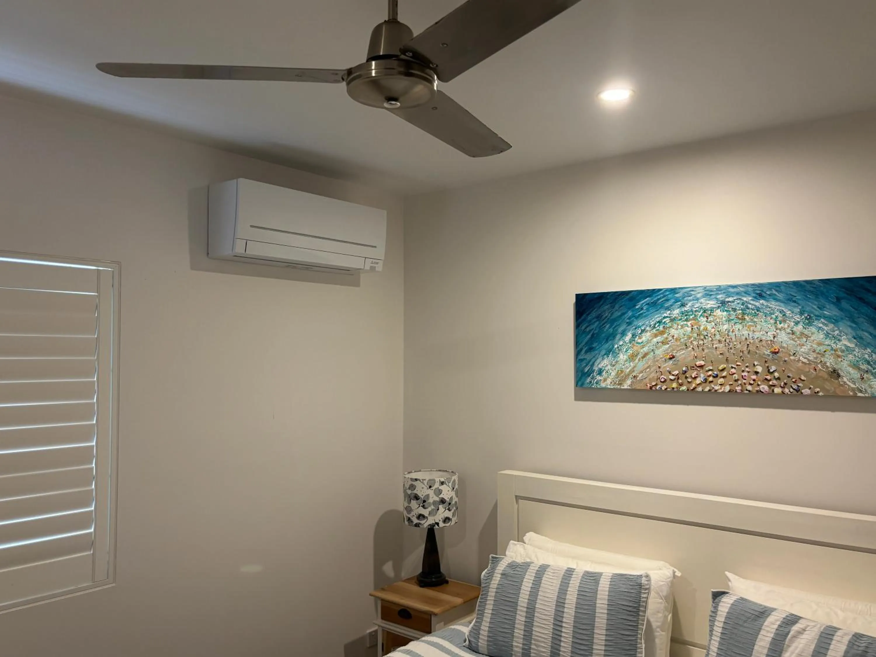 Bed in Aqua Promenade Beachfront Holiday Apartments