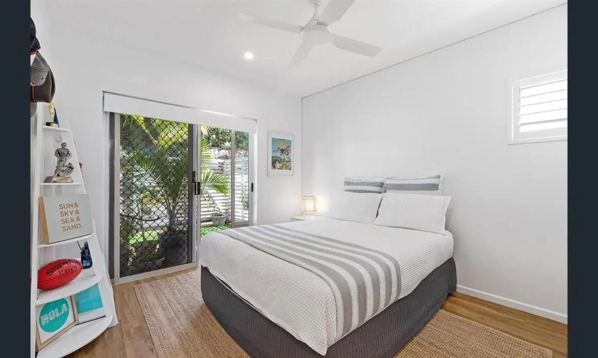 Bed in Aqua Promenade Beachfront Holiday Apartments