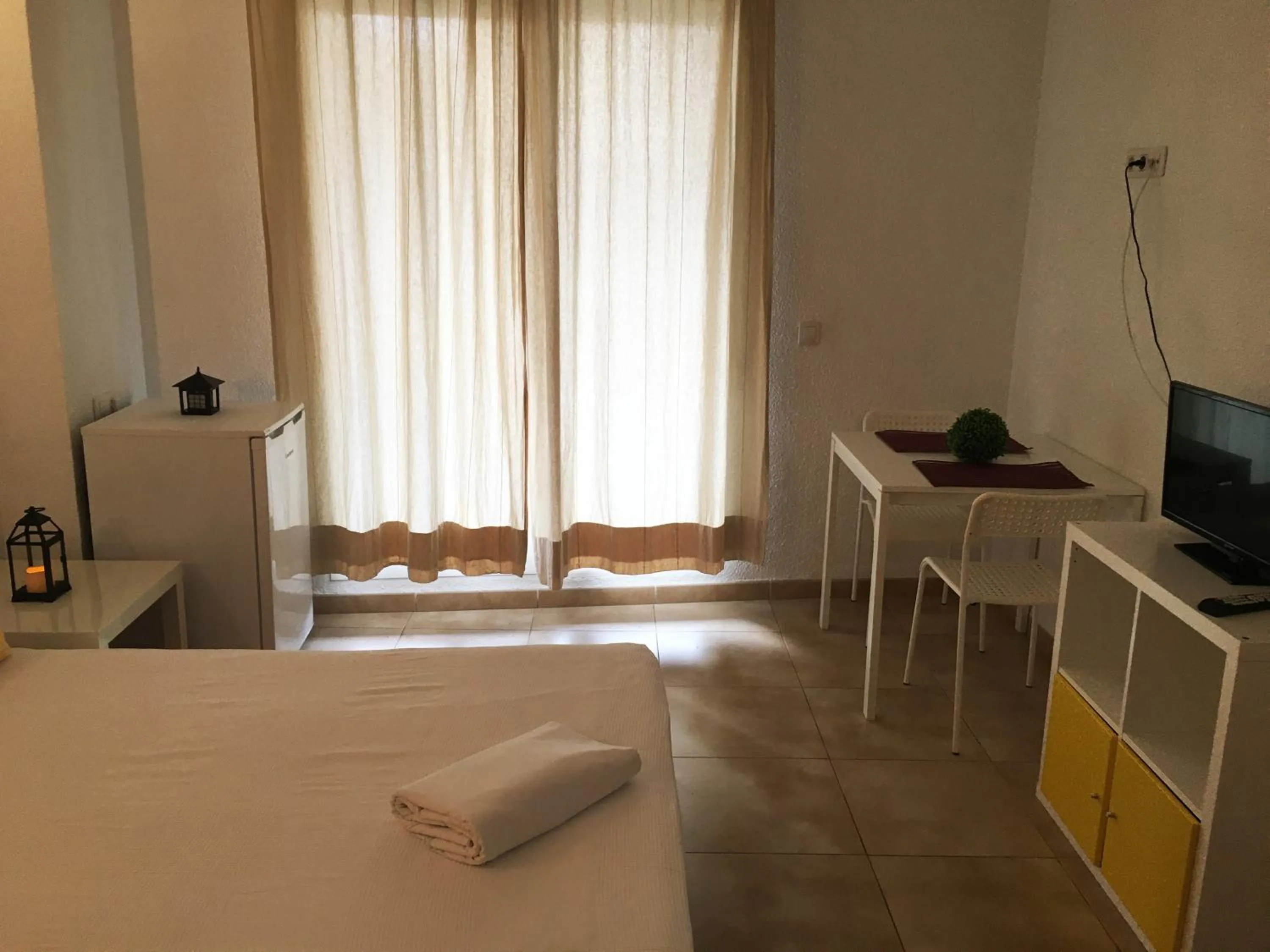 Living room, Bed in Apartamentos Doña Carmen 3000