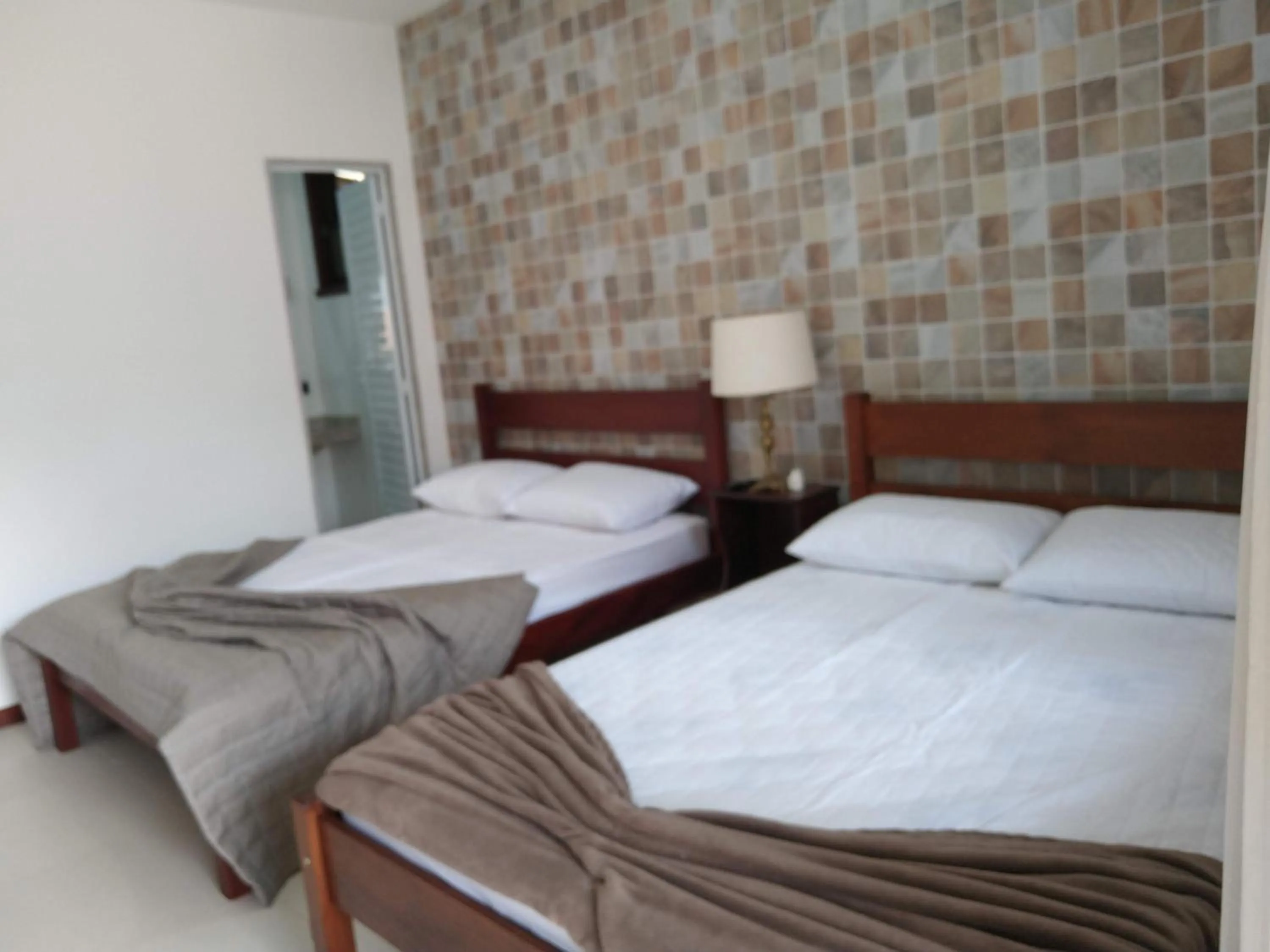 Bed in Pousada Fazendinha Unamar